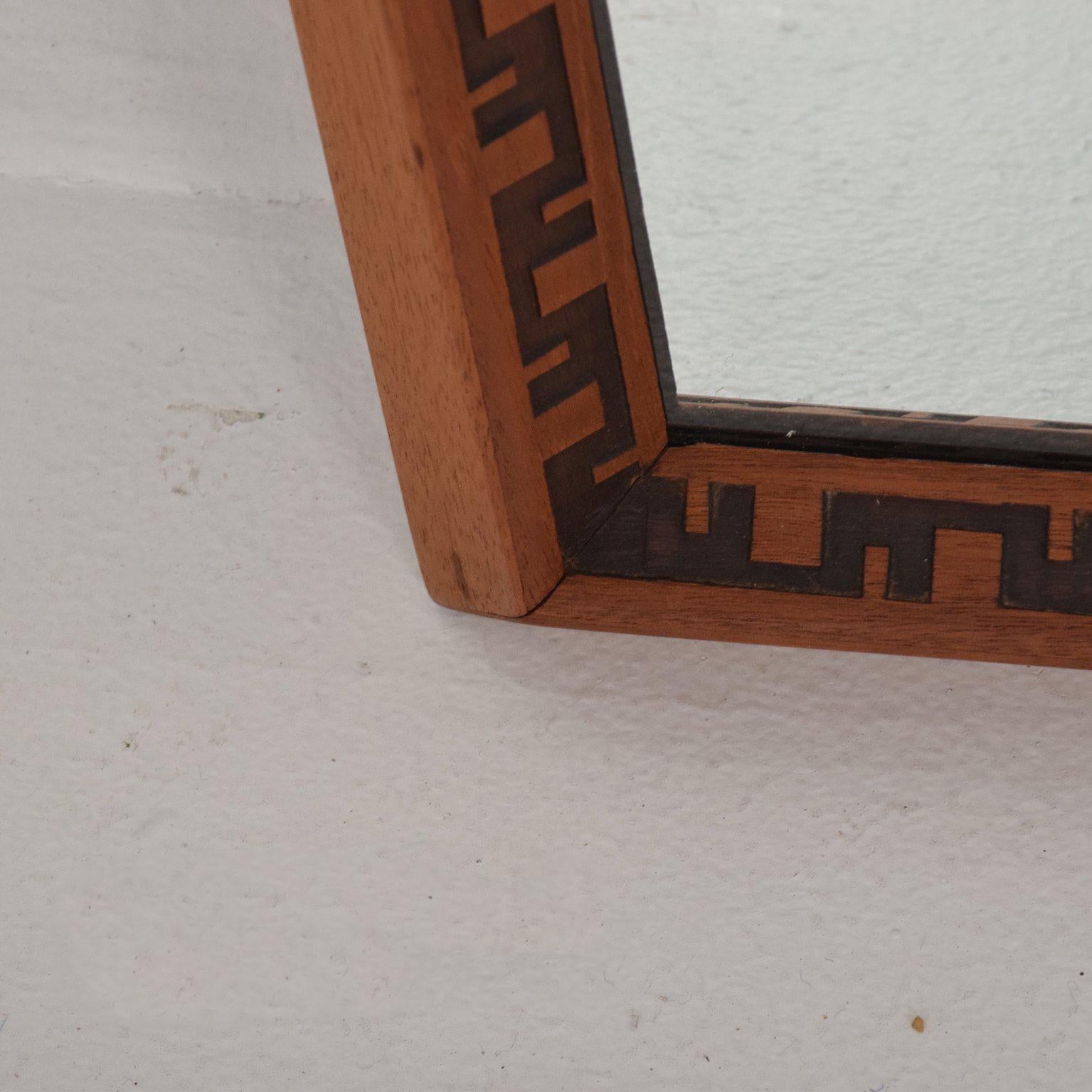 For your consideration a vintage mirror designed by Frank Lloyd Wright. Solid mahogany with iconic design. 
Original mirror has light vintage oxidation. Hard to see, but something that needs to be mentioned. 

USA made, circa 1950s

Measures: