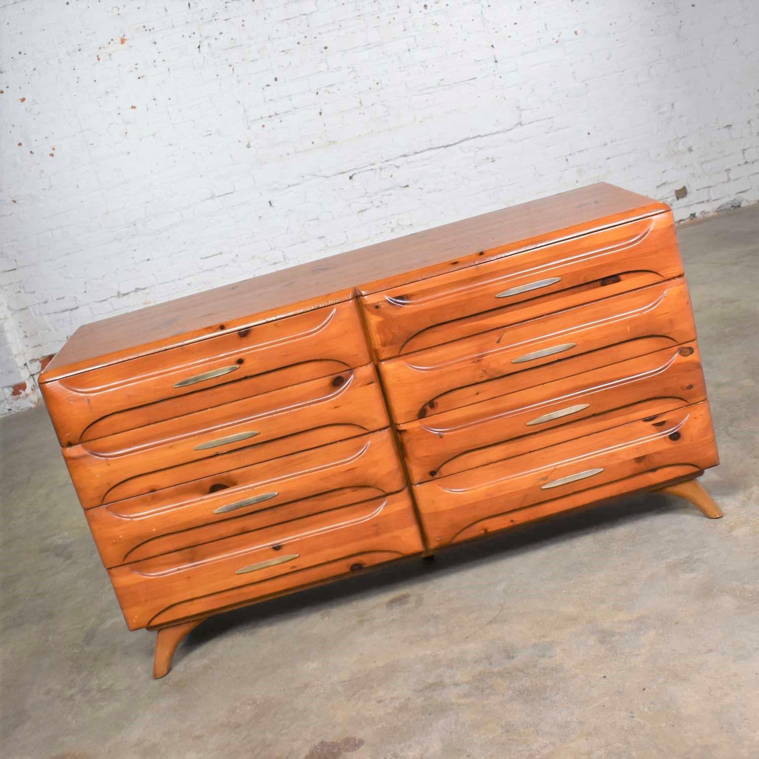 Handsome Mid-Century Modern low double dresser or credenza by Franklin Shockey Furniture from their Sculpted Pine Collection. In wonderful vintage condition with a beautiful age patina. We have not refinished this piece but restored with some touch