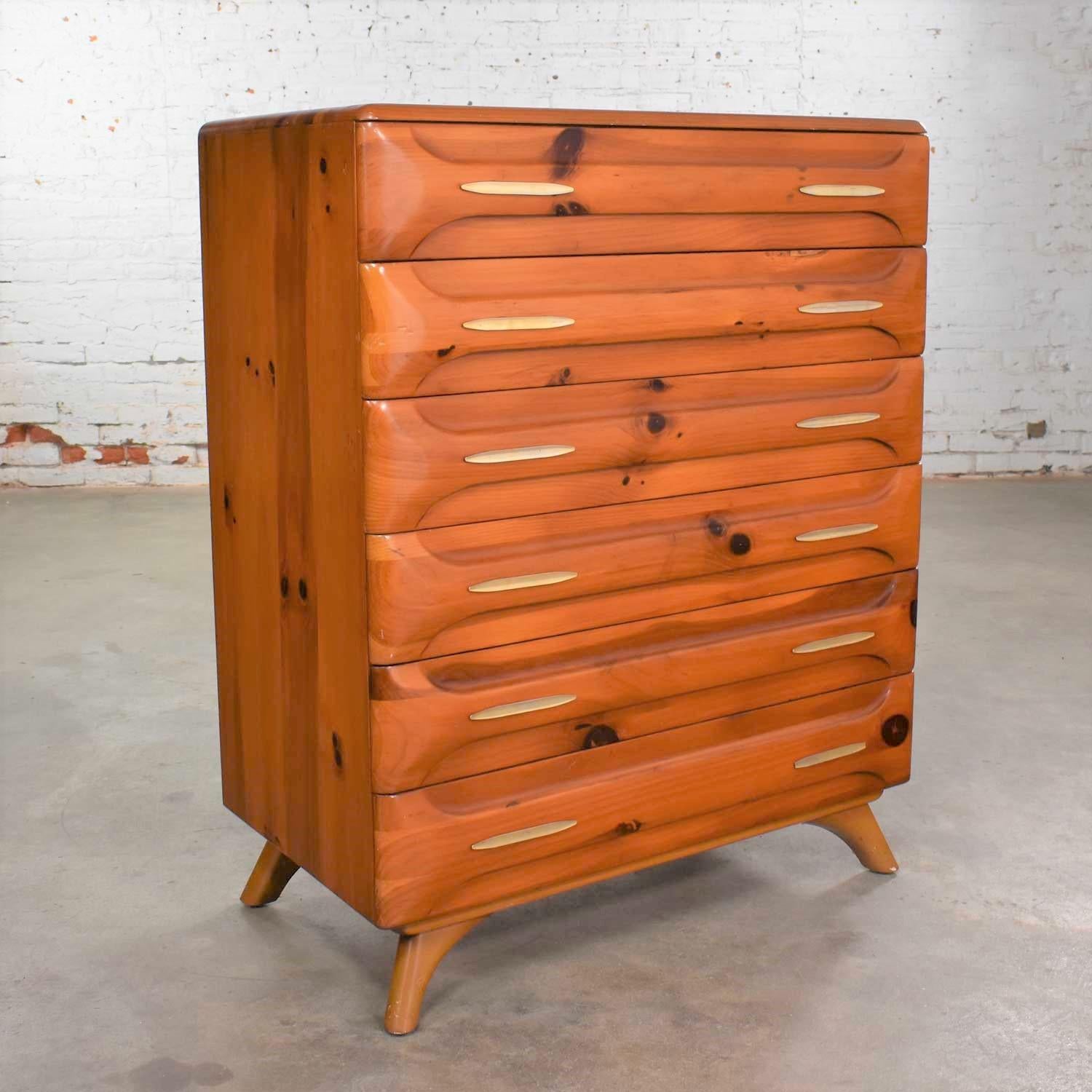 Handsome Mid-Century Modern tall chest of drawers by Franklin Shockey Furniture from their Sculpted Pine Collection. In wonderful vintage condition with a beautiful age patina. We have not refinished this piece but restored with some touch up to the