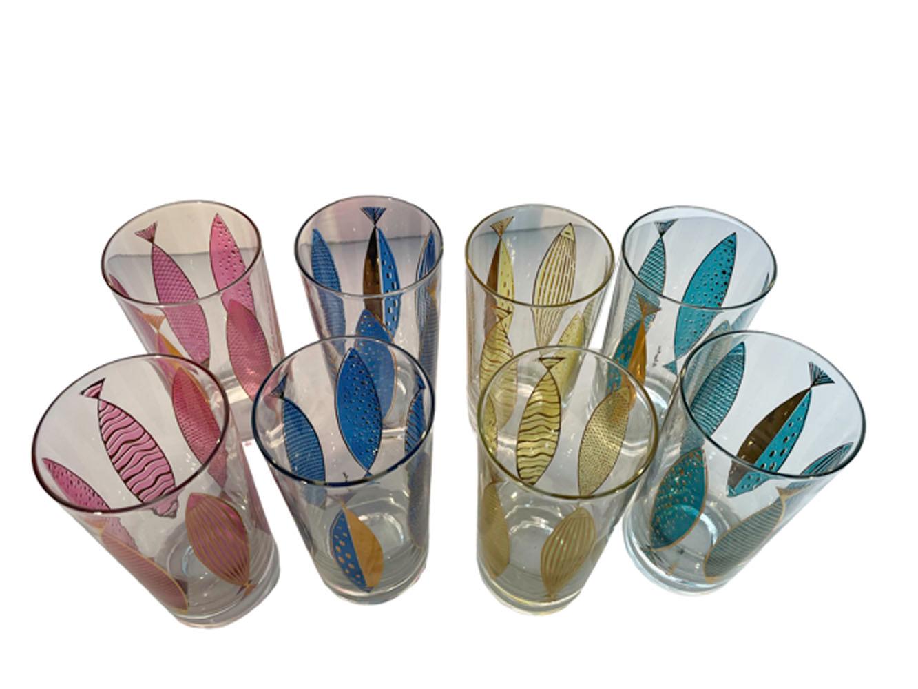 Eight Fred Press designed highball glasses in clear glass with stylized abstract patterned gold fish with bodies colored with translucent enamels, Two each of four colors, blue, green, purple and yellow.