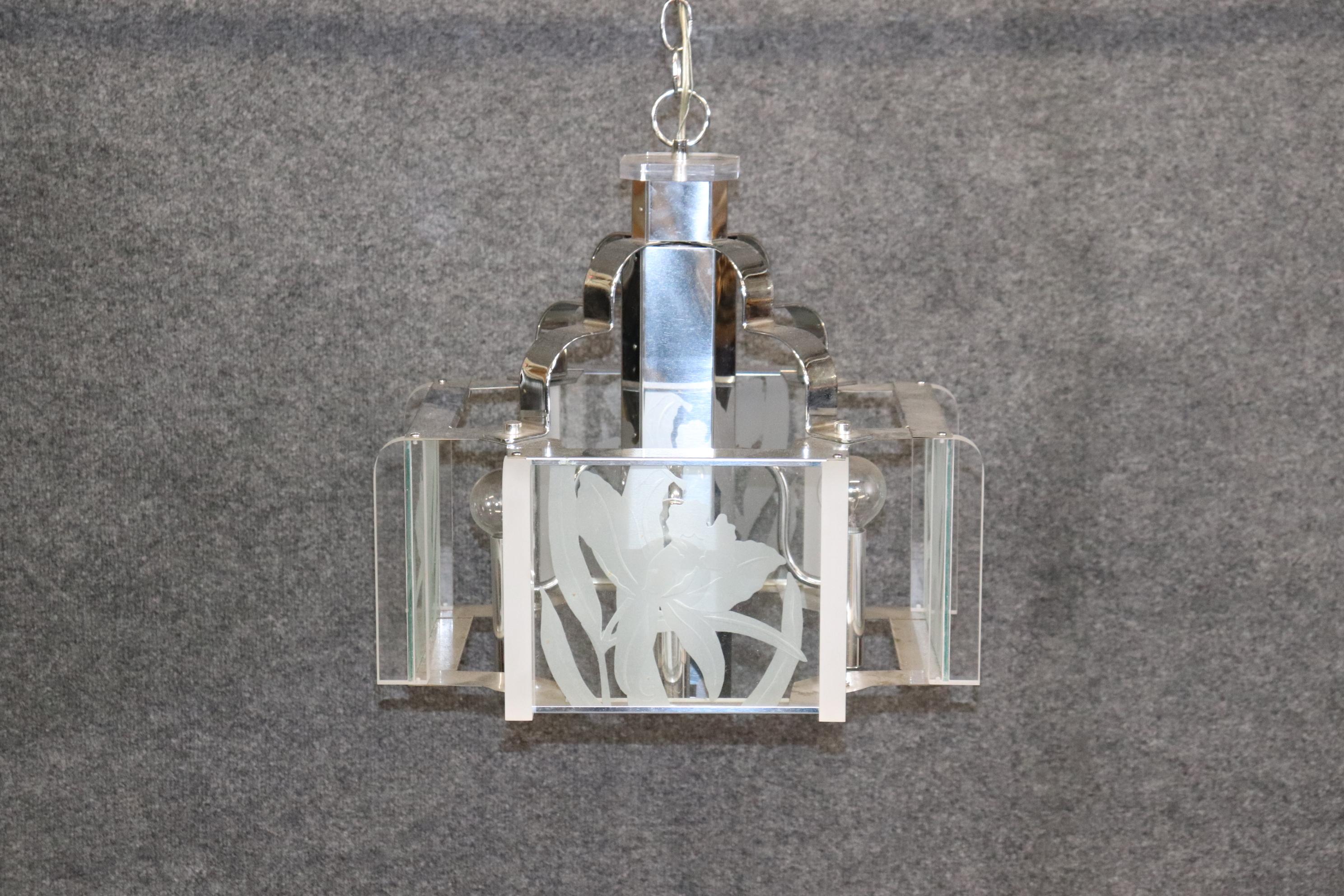 Dimensions- H: 18in W: 17in D: 17in

This vintage Frederick Raymond Art Deco style four light chandelier is something to be seen! Fredrick Raymond is a well-known brand that produces high-end lighting fixtures, including chandeliers. They are known