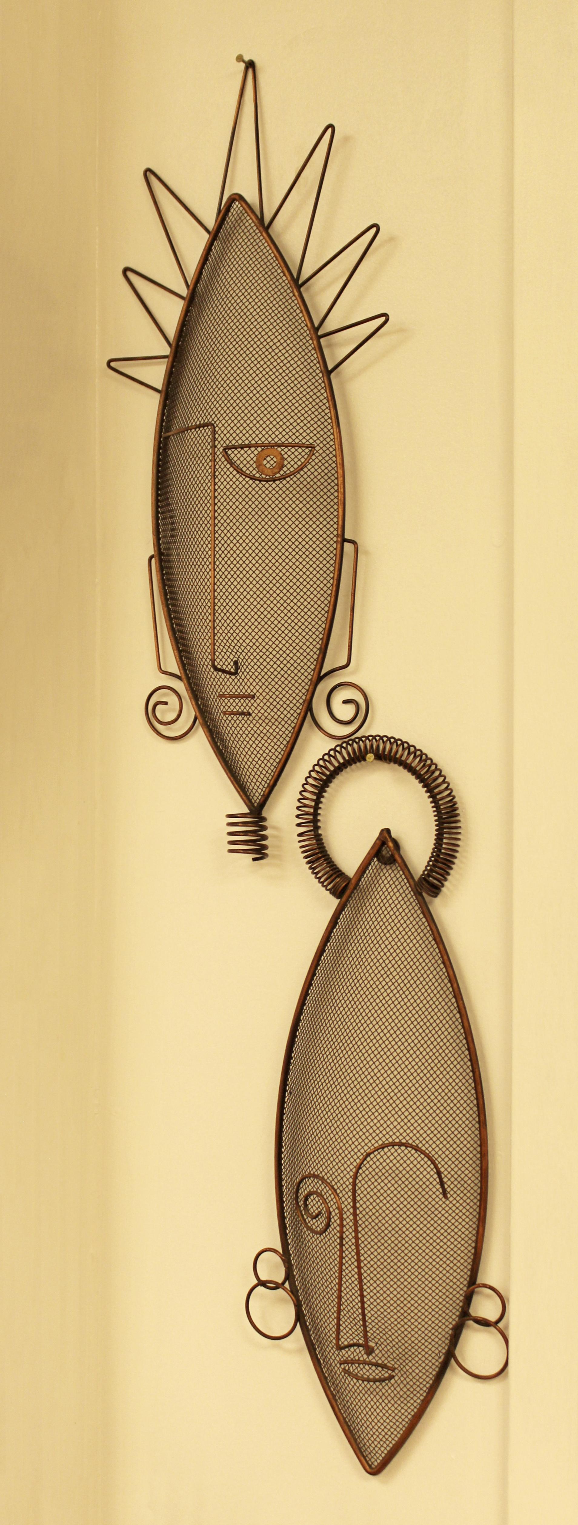 For your consideration is a gorgeous pair of wire mask wall sculptures by Frederick Weinberg, circa the 1950s. In excellent vintage condition. The dimensions of each are 7.5