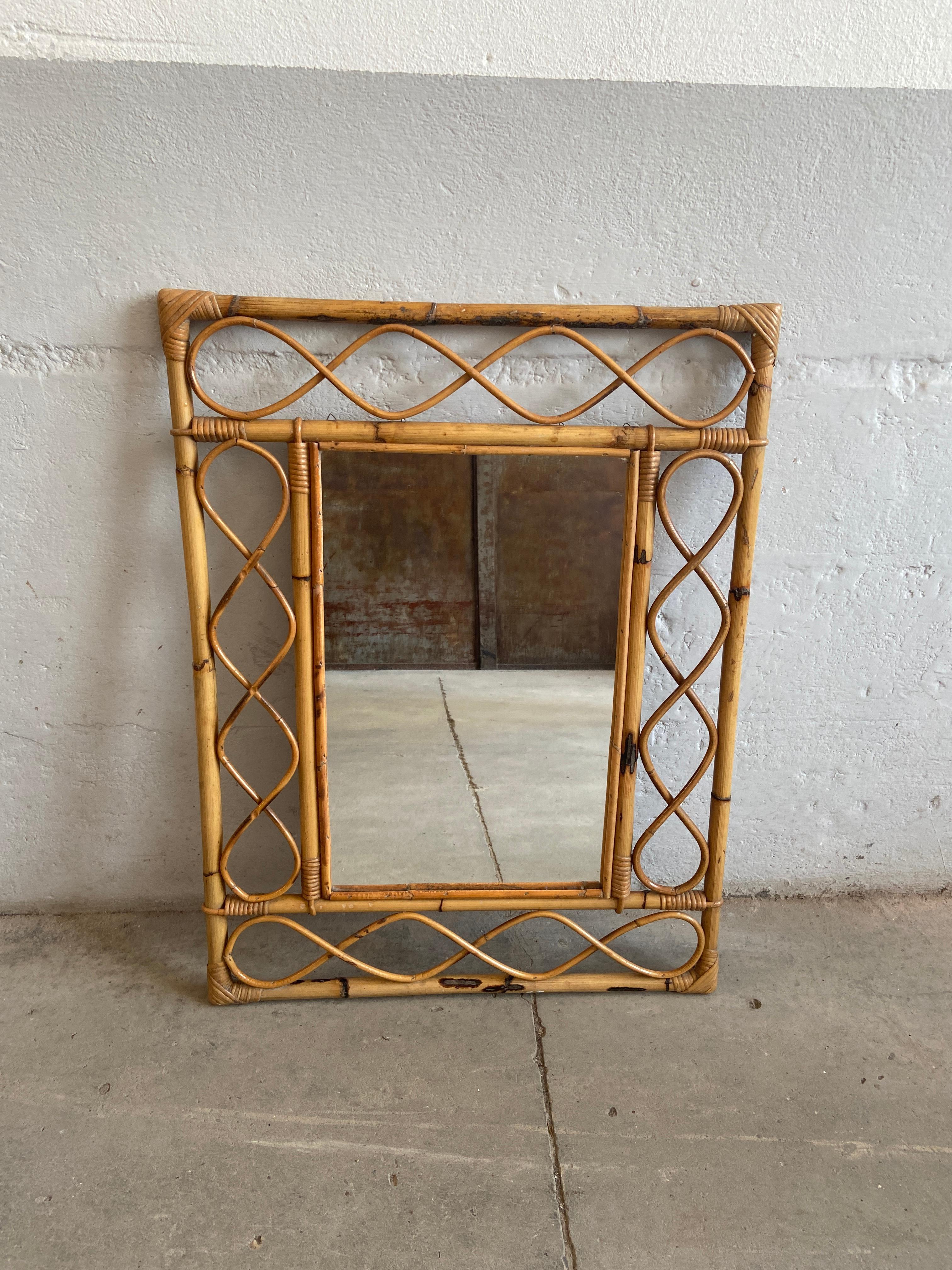 Mid-Century Modern French bamboo framed mirror.
The mirror could be hang both vertical or horizontal.