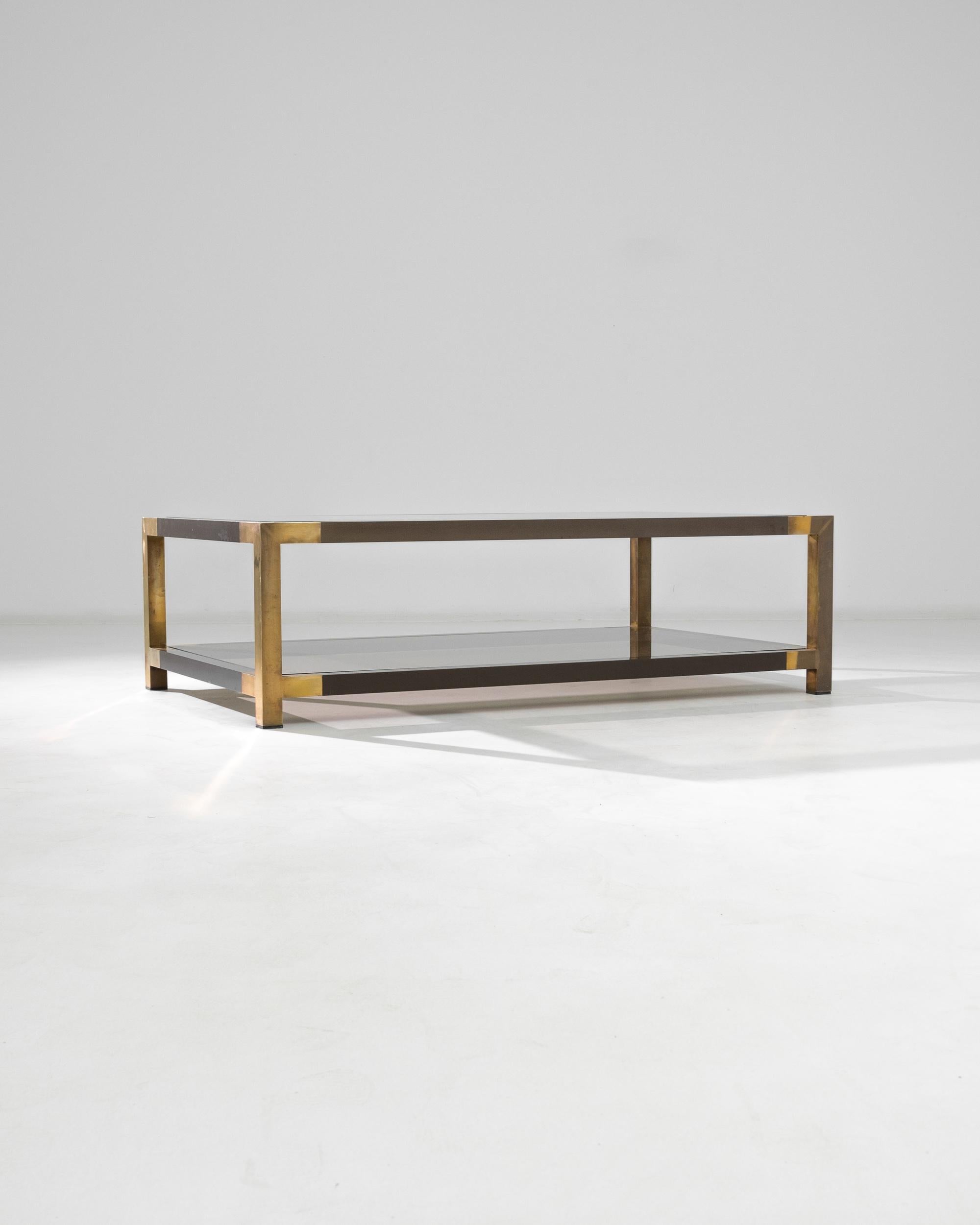 This contemporary coffee table from 20th Century France offers a sleek and streamlined luxury accent. A clean grid, realized in two-tone metal: the graphic contrast between the light and dark brass creates an impression of minimalist opulence. The