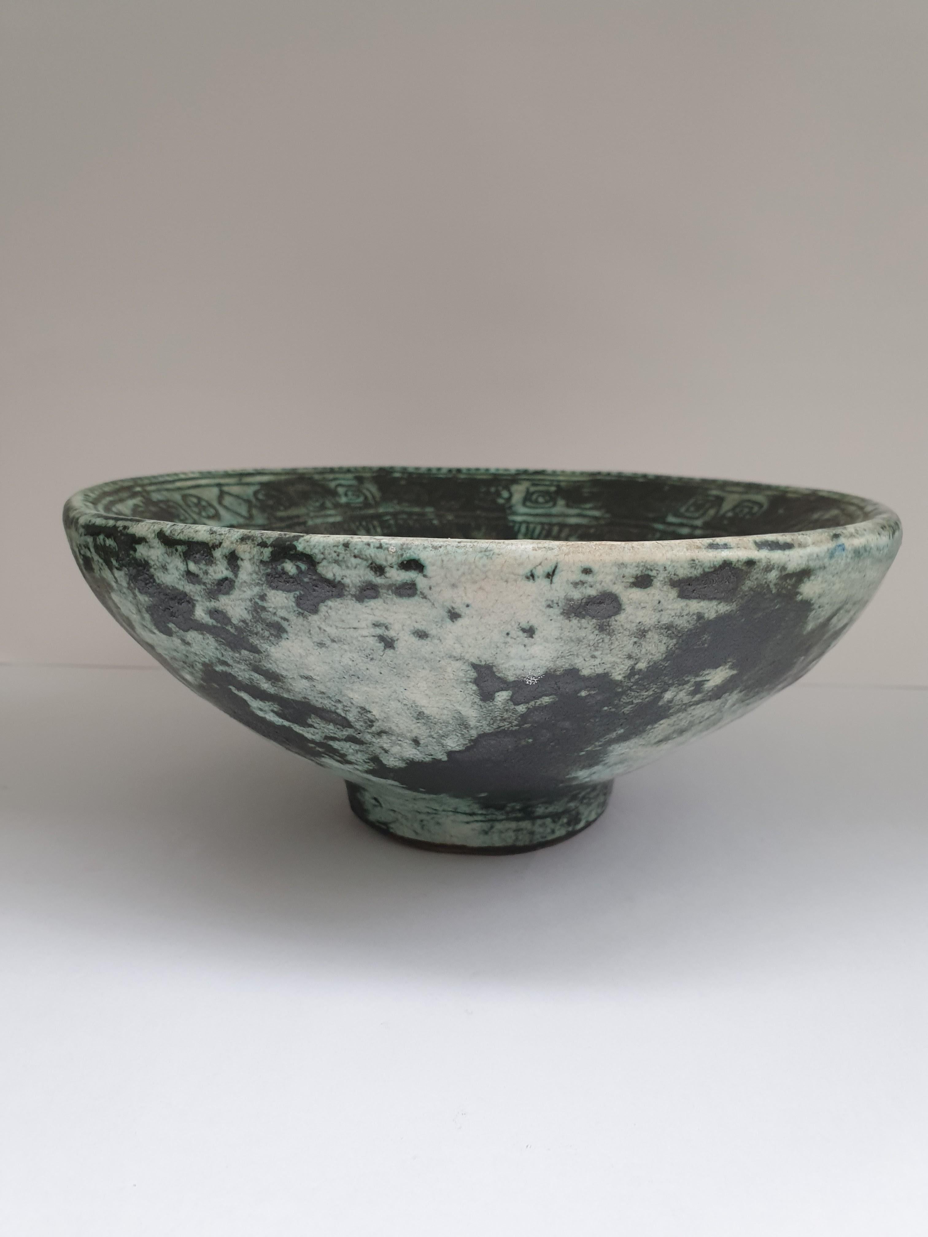 Simple matt glazed ceramic bowl by Jacques Blin depicting stylized birds.

Jacques Blin began making pottery in the late 1940s and his early work made use of modeling techniques, as well as slip casting and stamping, before moving on to wheel