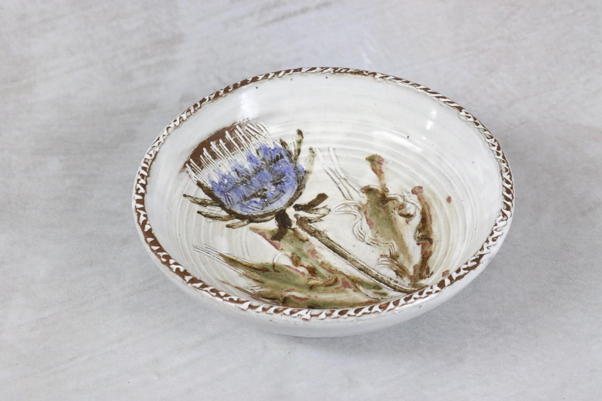 Mid-Century Modern French Ceramic Platter by Albert Thiry, 1960s, era Blin

One beautiful glazed ceramic platter with an engraved and hand-painted blue thistle flower bud.
We find the vocabulary of preference of the ceramist: a chalky white