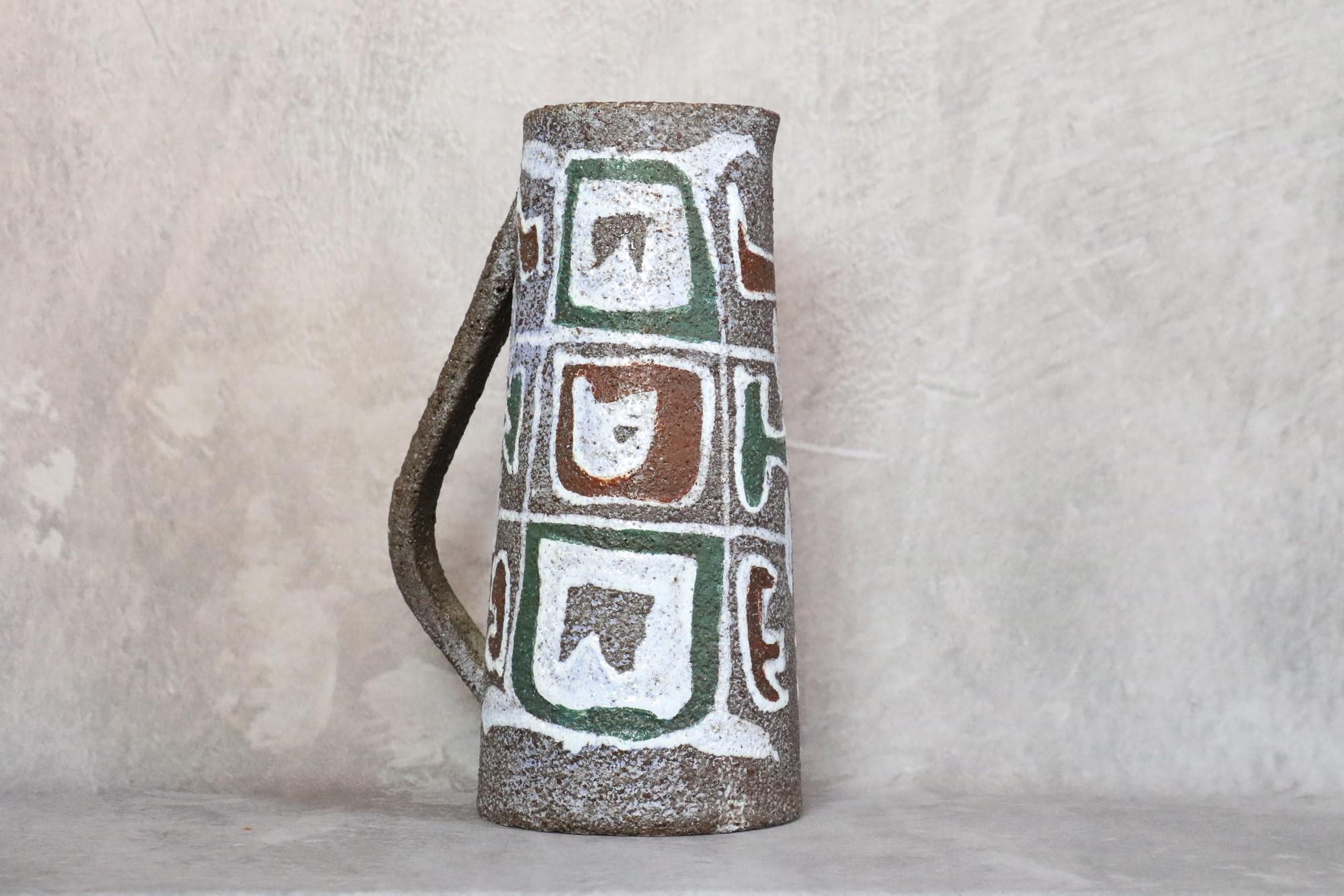Mid-Century Modern French earthenware pitcher signed accolay, 

Beautiful ceramic pitcher decorated with geometrics decor.
The use of a dark earthenware color brings out the elegant contrast of the decoration. This is a beautiful textured ceramic