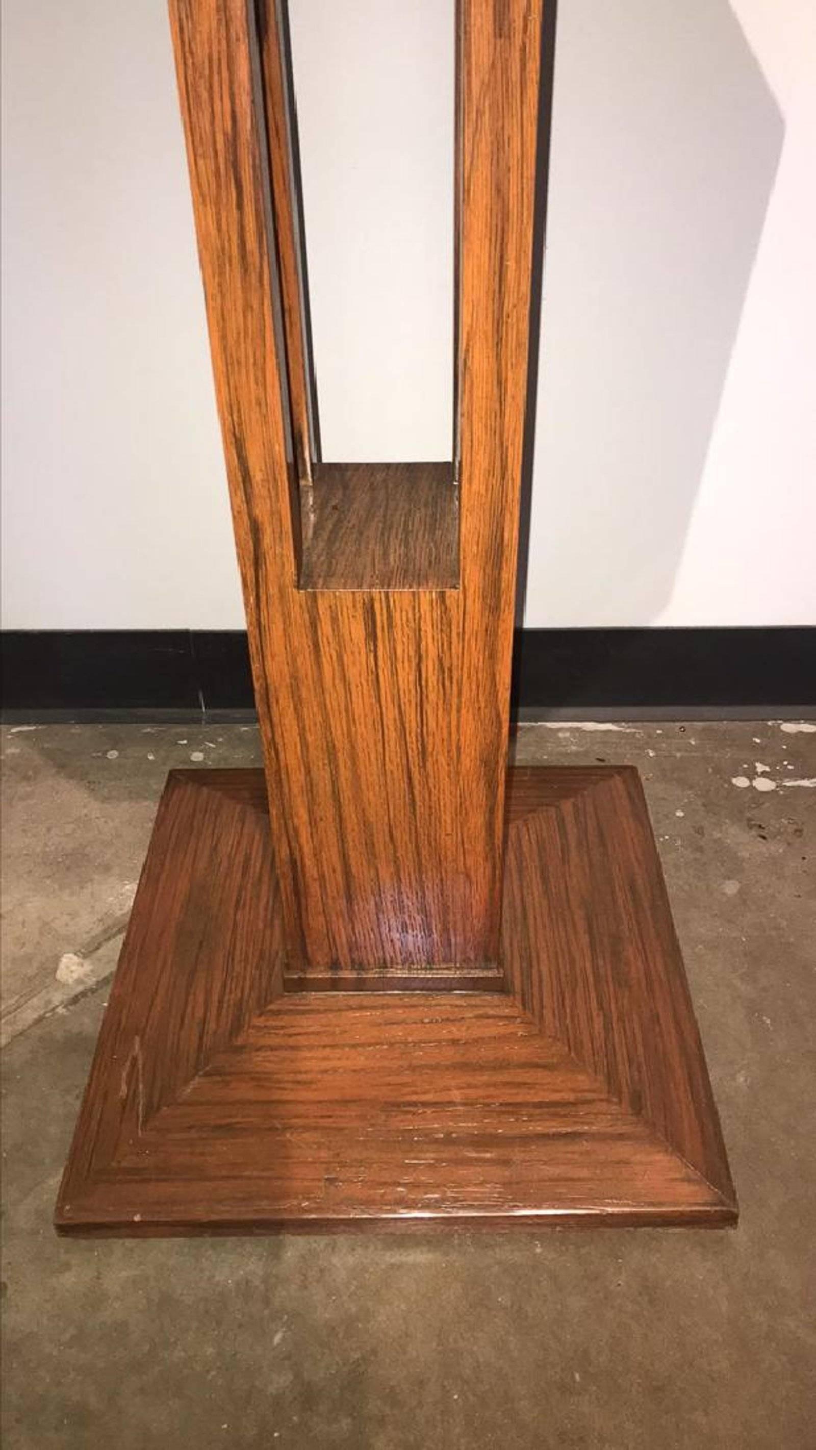 Nicely scaled Mid-Century Modern exotic oak octagonal table on an open-work pedestal platform base.