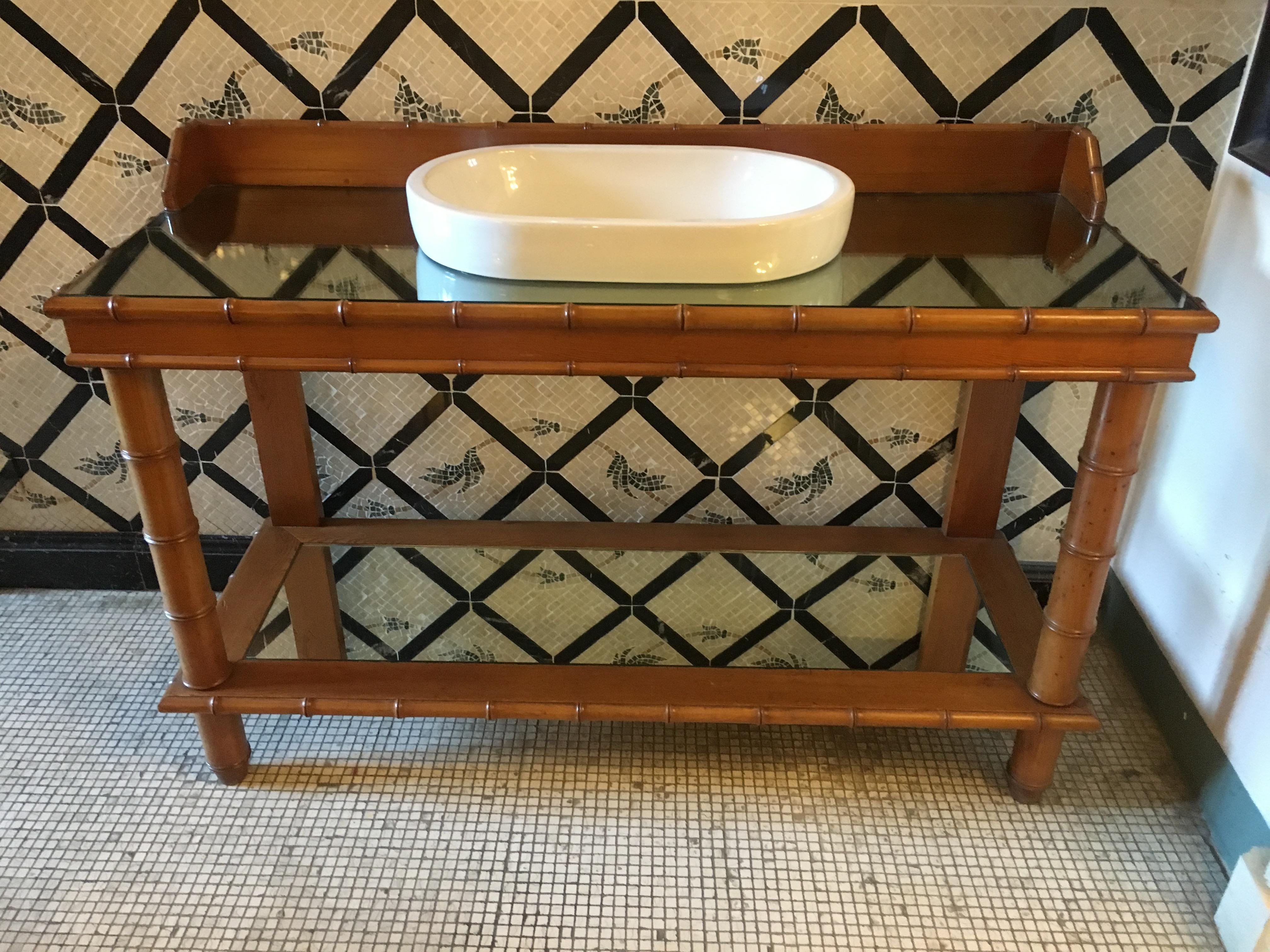 Mid-Century Modern French faux bamboo cupboard sink with mirror top, 1920s.
This piece was a faux bamboo console converted into sink.
 