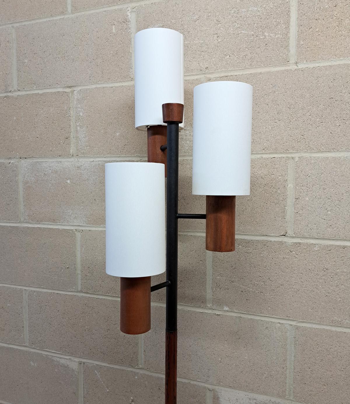 Teak and black Steel floor lamp in the style of Rispal Paris, made in the 1960s / 1970s. Three new white cotton lampshade makes the lights, newly rewired.