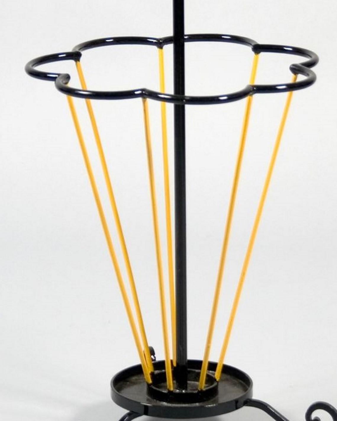 Unusual Mid Century Modern French lacquered metal umbrella stand. This stand is very practical and whimsical  and would grace any hallway. There are signs of usage to the painted finish.