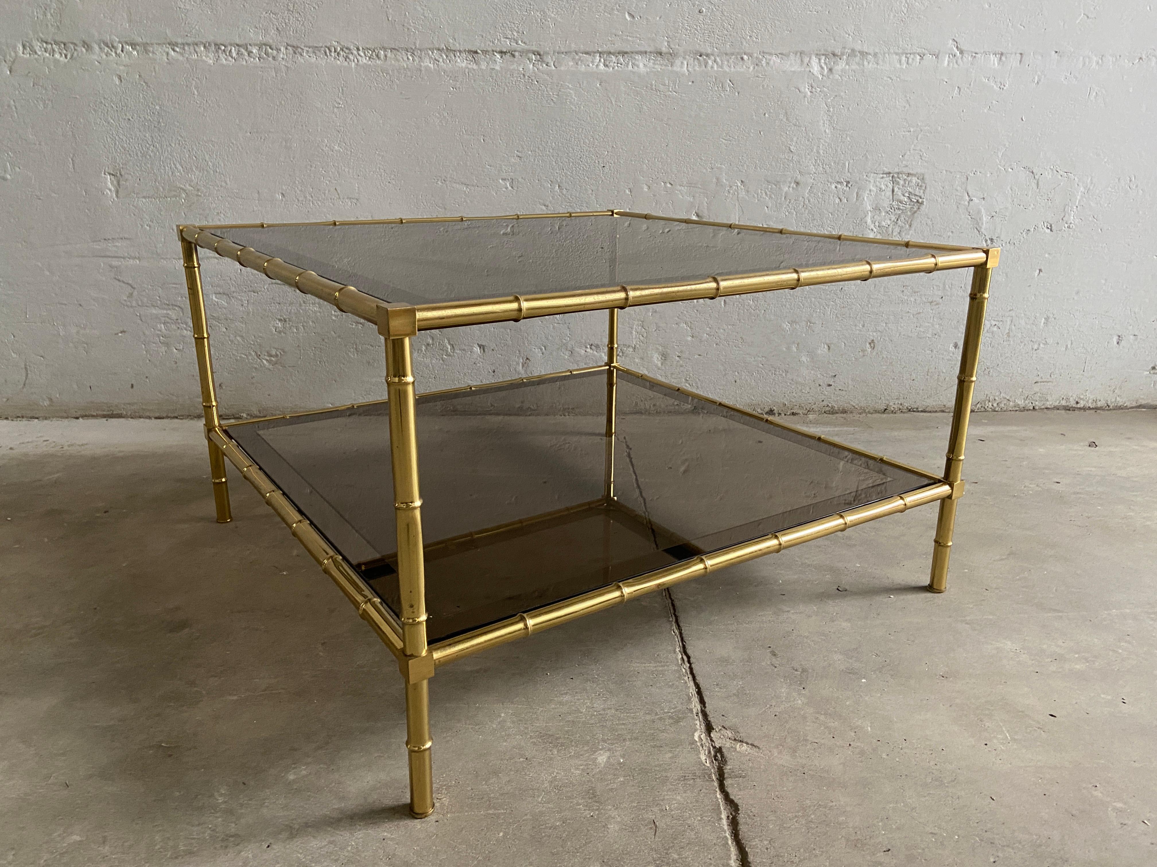 Mid-Century Modern French two-tier coffee or sofa table in faux bamboo brass with mirrored edges smoked glasses by Maison Baguès.