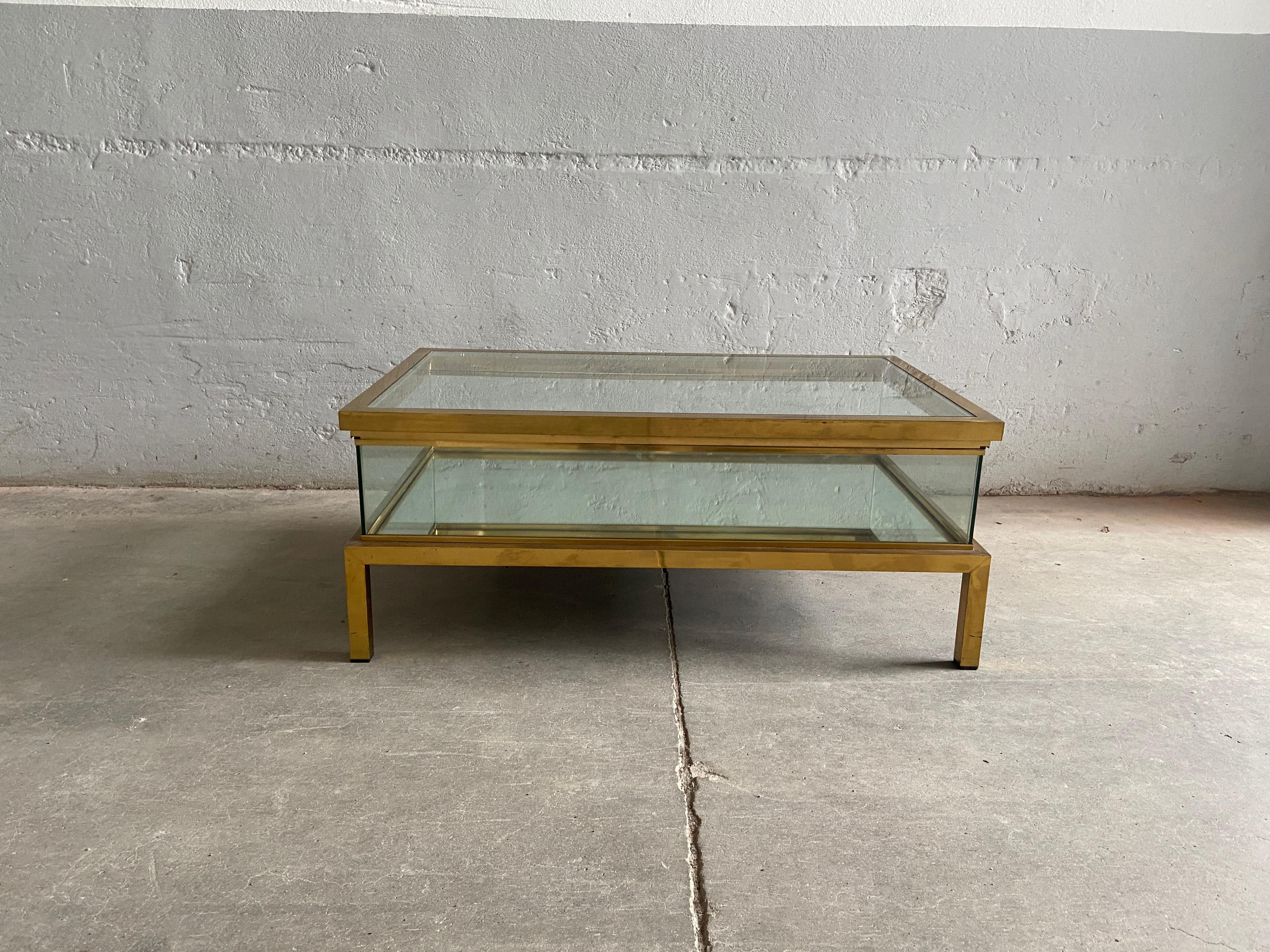 Mid-Century Modern French Maison Jansen brass coffee table with mirror bottom and sliding brass framed top.