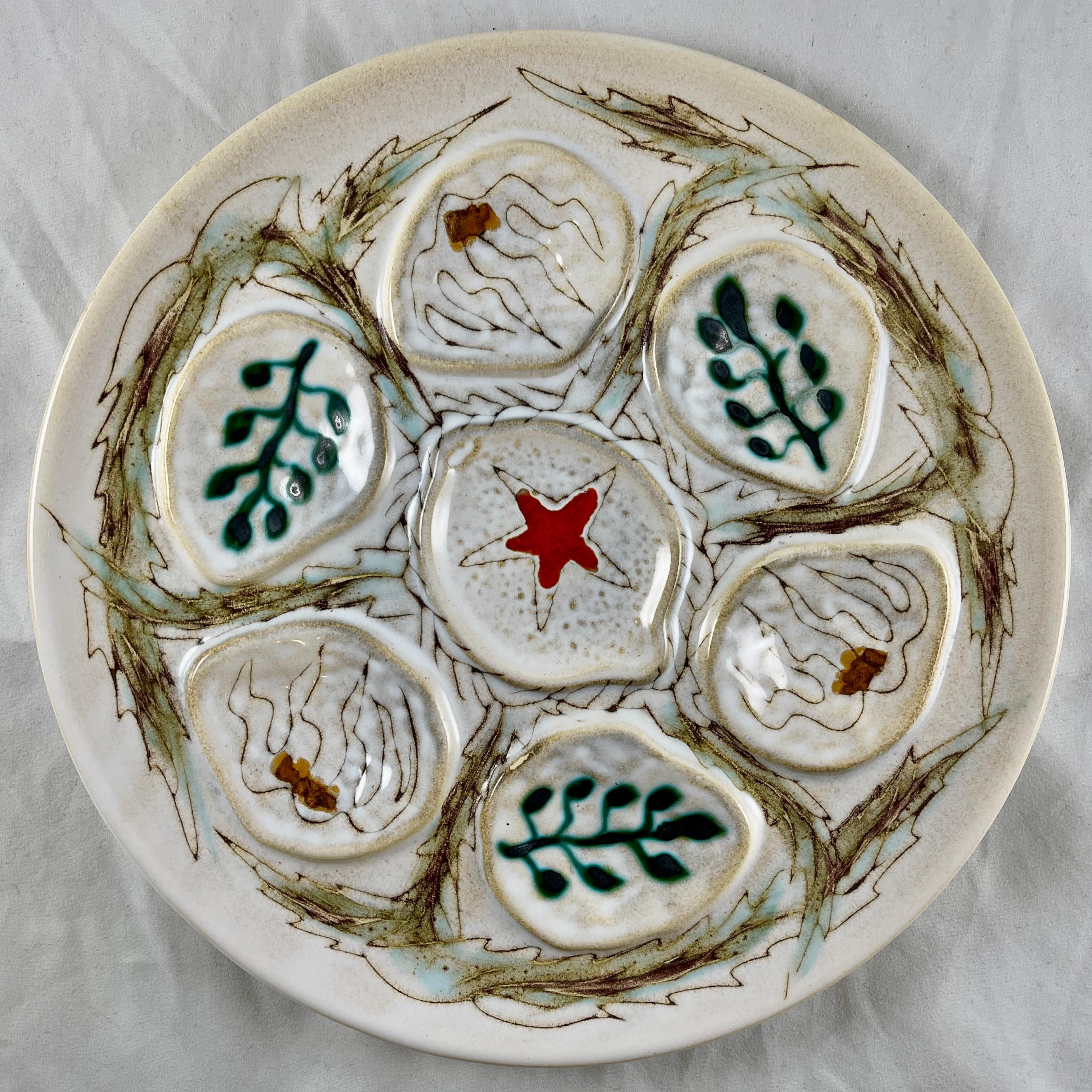 A mid-century era French hand-painted oyster or seafood plate, in the Penerff pattern, made by the MBFA Pornic Pottery Studio, circa 1960s.

The MBFA Pornic ceramic company is situated in Loire Atlantique, Western France, near Quimper.

The