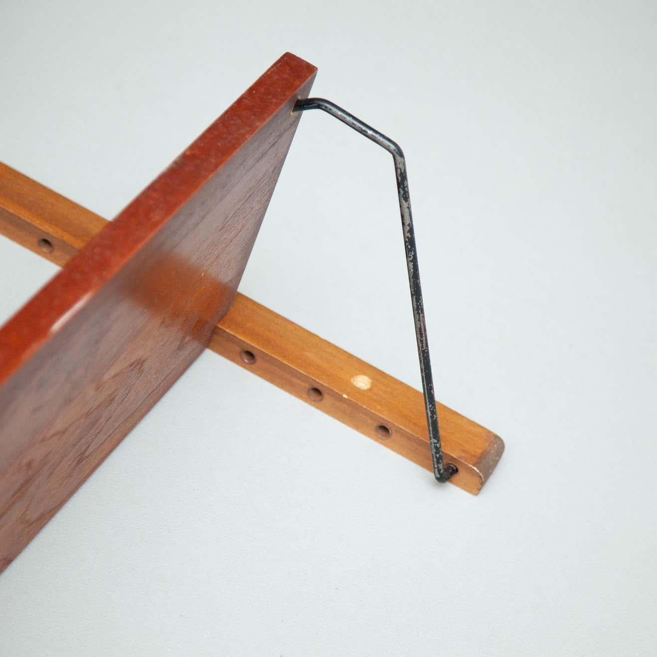 Mid-Century Modern French shelve.  By unknown manufacturer from France, circa 1950.    In original condition, with minor wear consistent with age and use, preserving a beautiful patina.    Material:  Wood  Metal    Dimensions:  D cm x W cm x H cm.