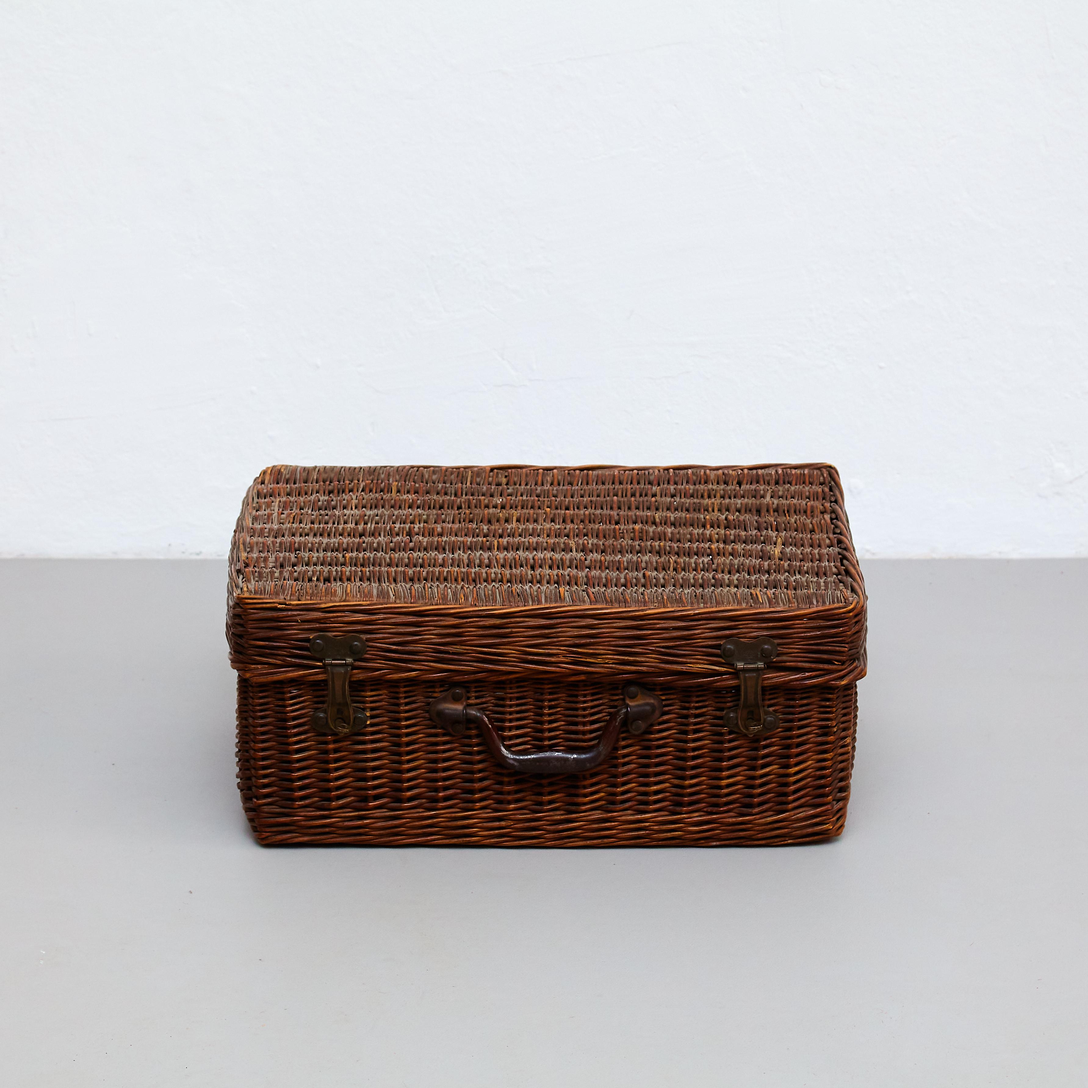 Mid-Century Modern French rattan basket.

In original condition with minor wear consistent of age and use, preserving a beautiful patina.

Materials: 
Rattan 

Dimensions: 
D 32 cm x W 51.7 cm x H 22.5 cm.

Important information regarding