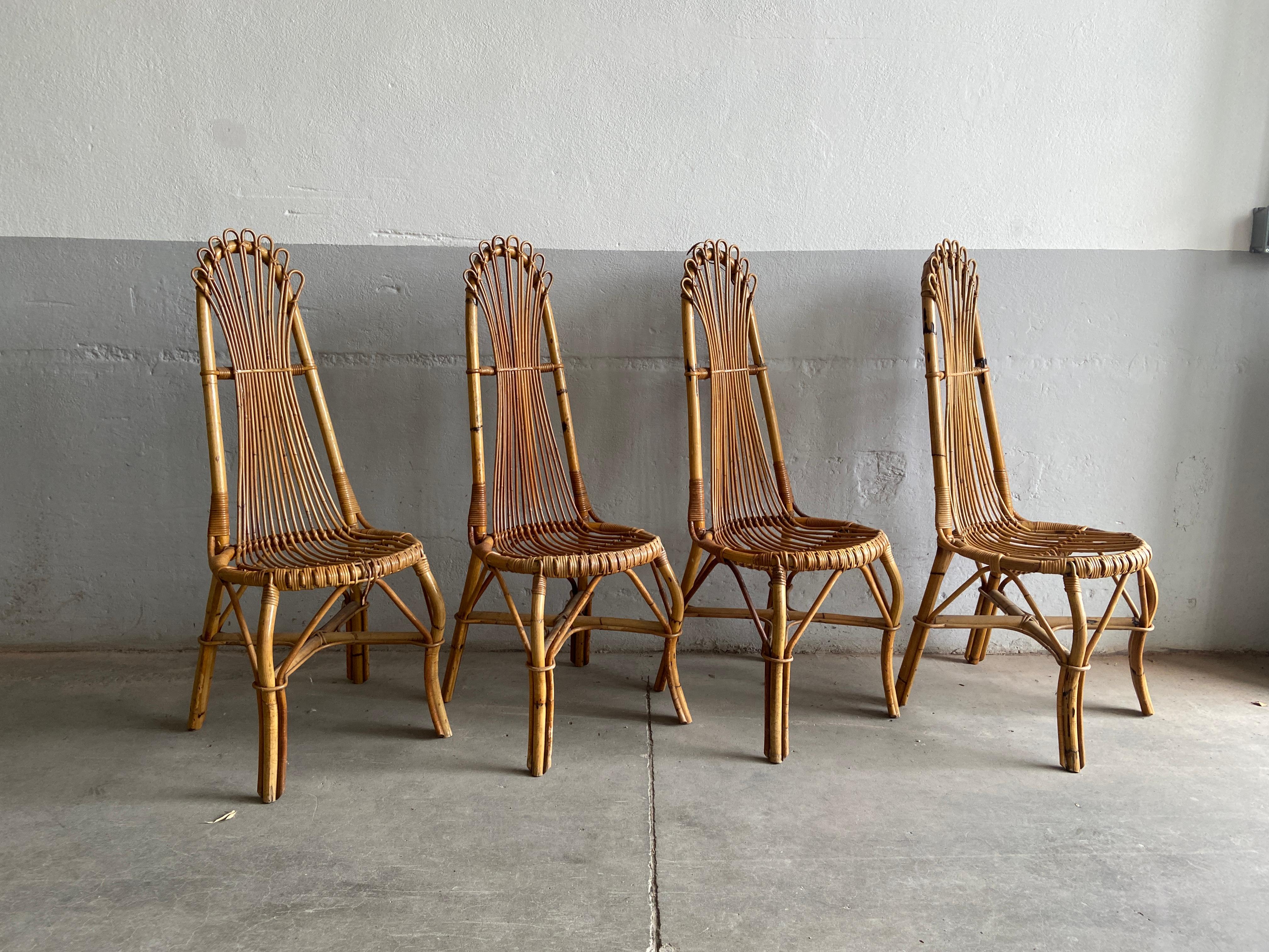 Mid-Century Modern set of 4 French Riviera bamboo and rattan dining room chairs.