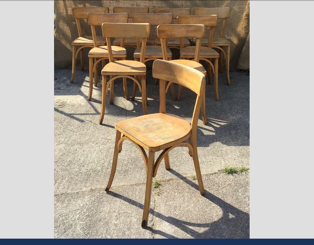Mid-Century Modern French set of 10 bistro wooden chairs, 1950s.
 
