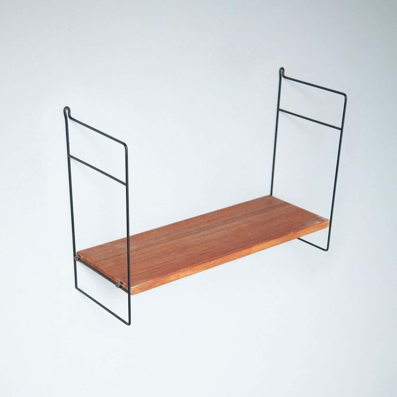 Mid-Century Modern French shelve.
By unknown manufacturer from France, circa 1950.

In original condition, with minor wear consistent with age and use, preserving a beautiful patina.

Material:
Wood
Metal.
 