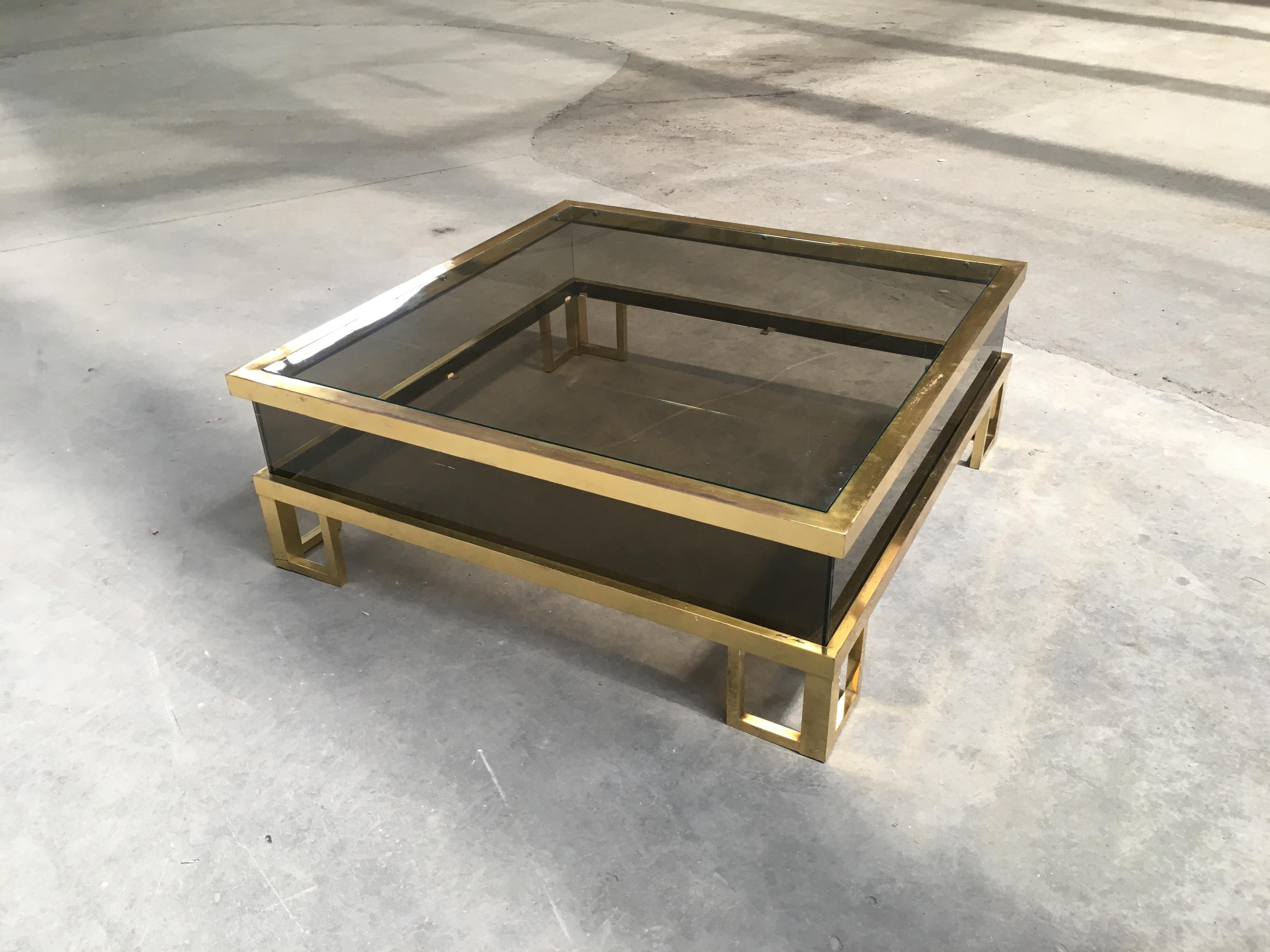 Mid-Century Modern French sliding top brass and smoked glass coffee table by Maison Jansen, 1970s.