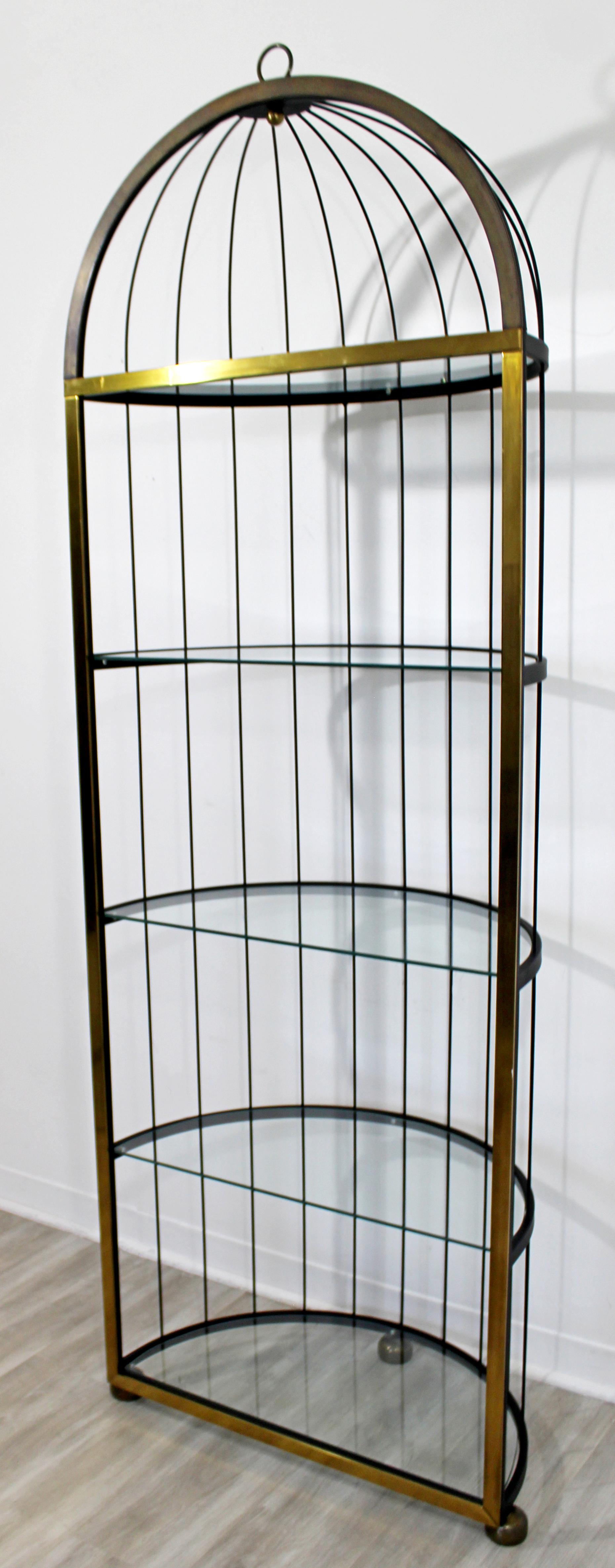 For your consideration is an utterly fabulous, French shelving unit birdcage étagère, made of steel and brass, and with five glass shelves, circa 1960s. In excellent vintage condition. The dimensions are 28