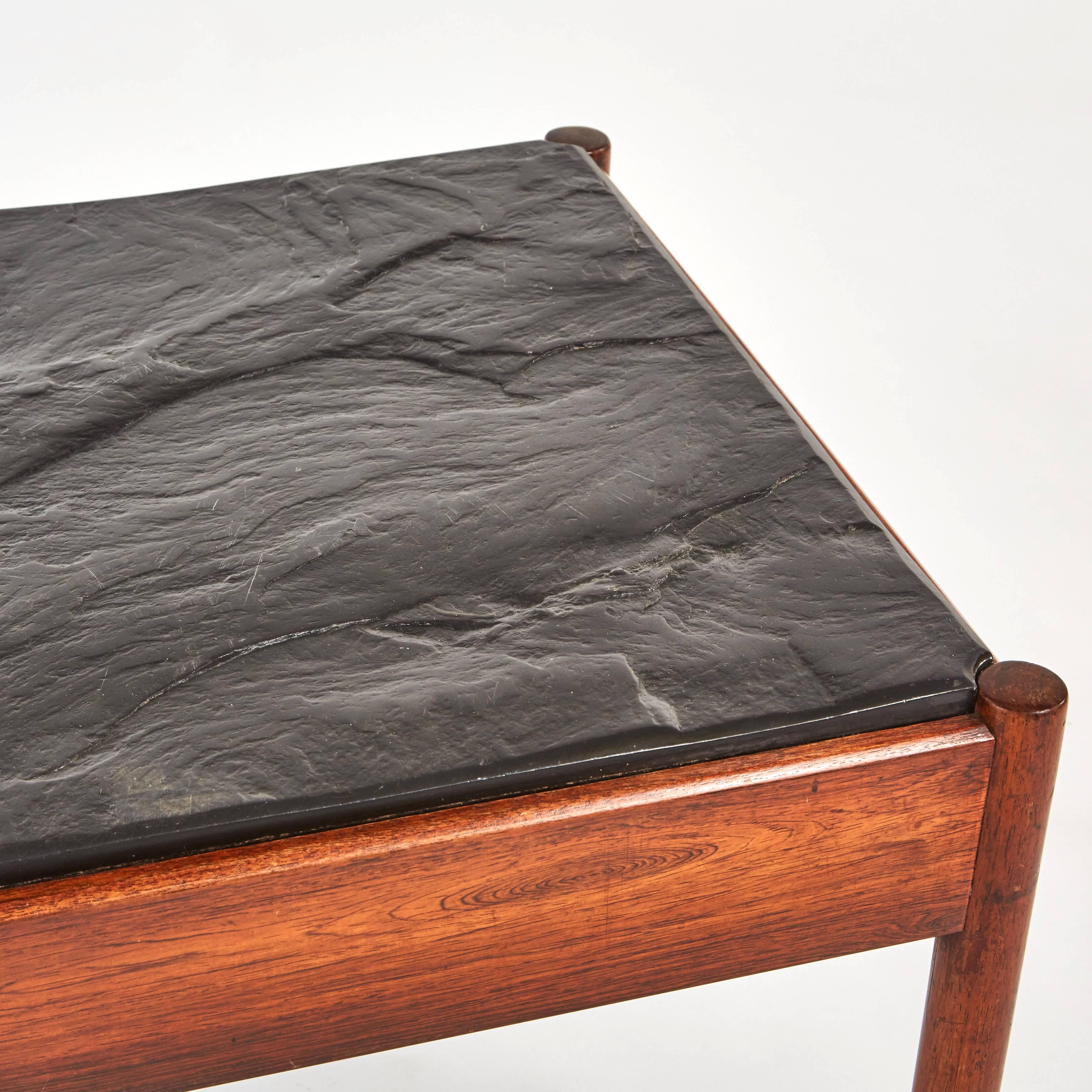 Mid-Century Modern French stone top coffee table with mahogany base. This table has a stone inlay that has been left to a natural finish, embracing the wabi and beauty of the natural formation of the stone. 