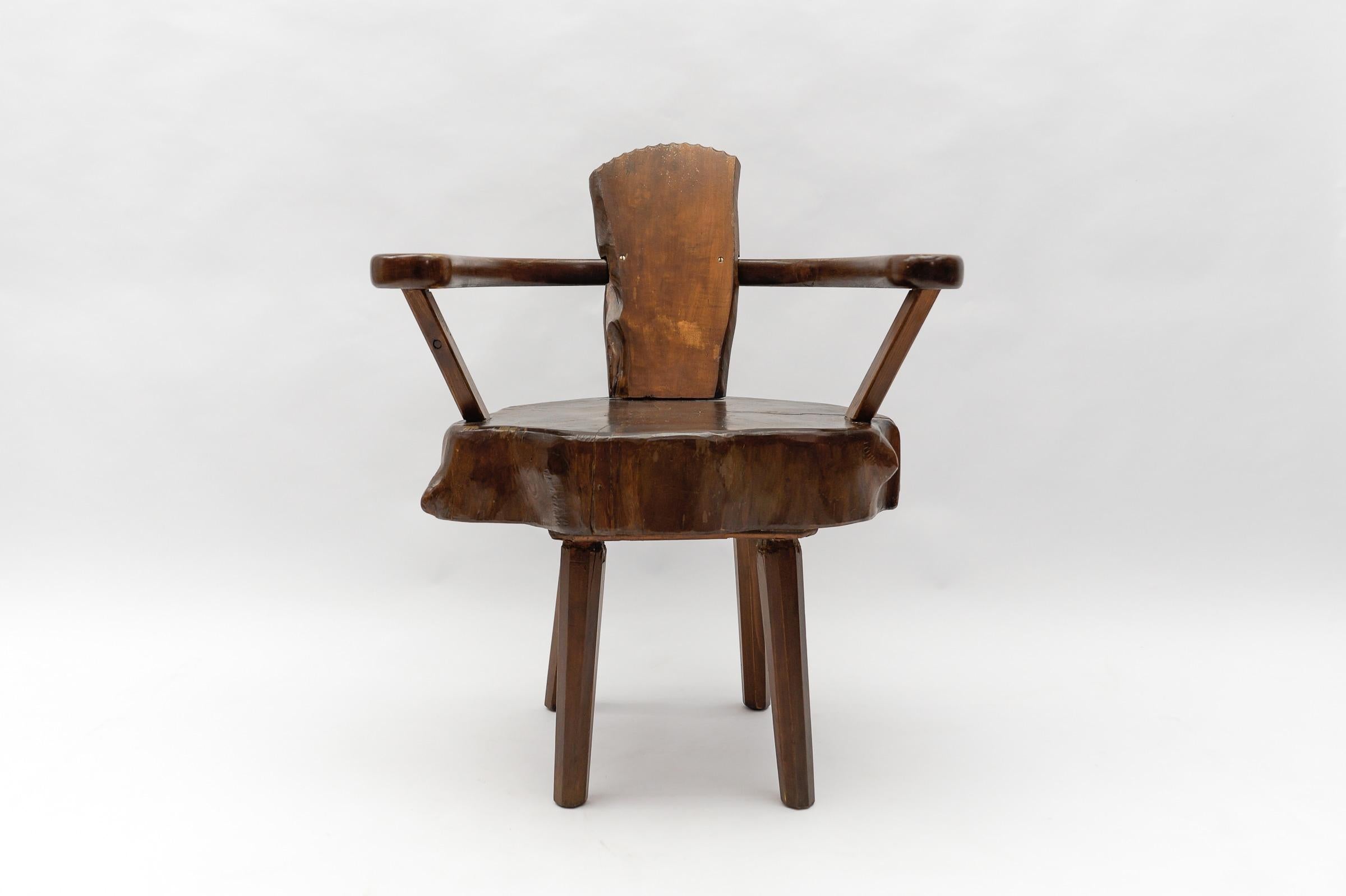 A total of four are available and are offered for sale here on the platform. 

Dark stained. Cool optic. Handmade imposing wooden armchair. Each armchair is unique.

This armchair here has a seat height of 46.5cm. The tree trunk thickness is