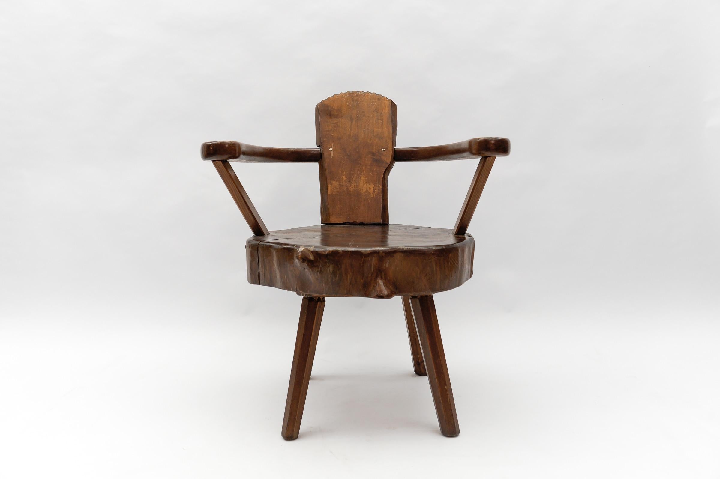 A total of four are available and are offered for sale here on the platform. 

Dark stained. Cool optic. Handmade imposing wooden armchair. Each armchair is unique.

This armchair here has a seat height of 42.5cm. The tree trunk thickness is