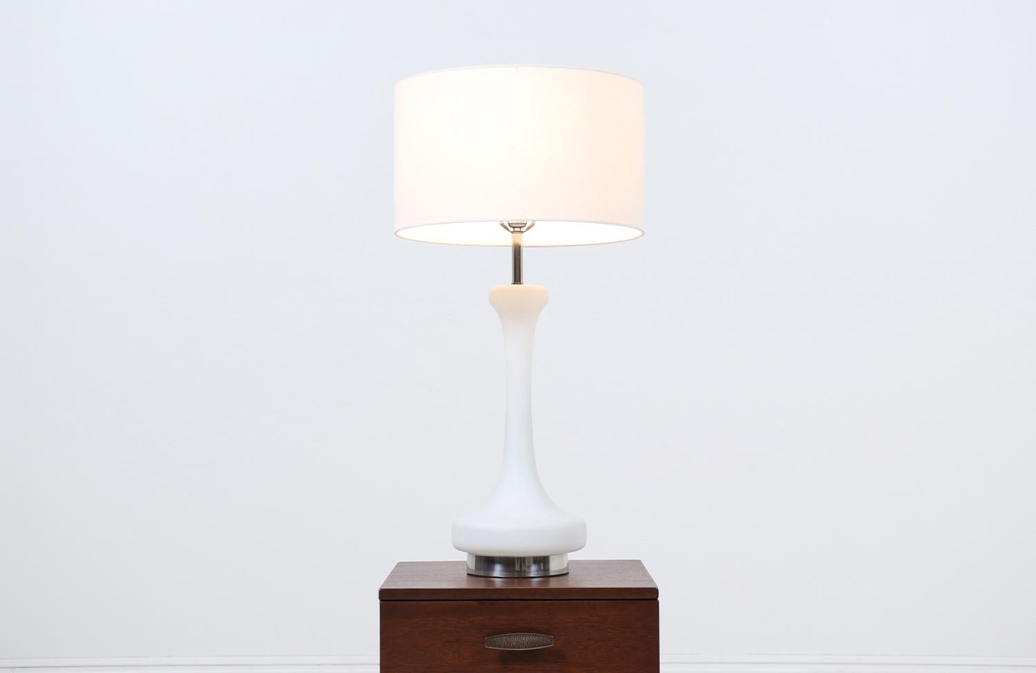 Mid-Century Modern frosted glass table Lamp by Laurel.

________________________________________

Transforming a piece of Mid-Century Modern furniture is like bringing history back to life, and we take this journey with passion and precision. With