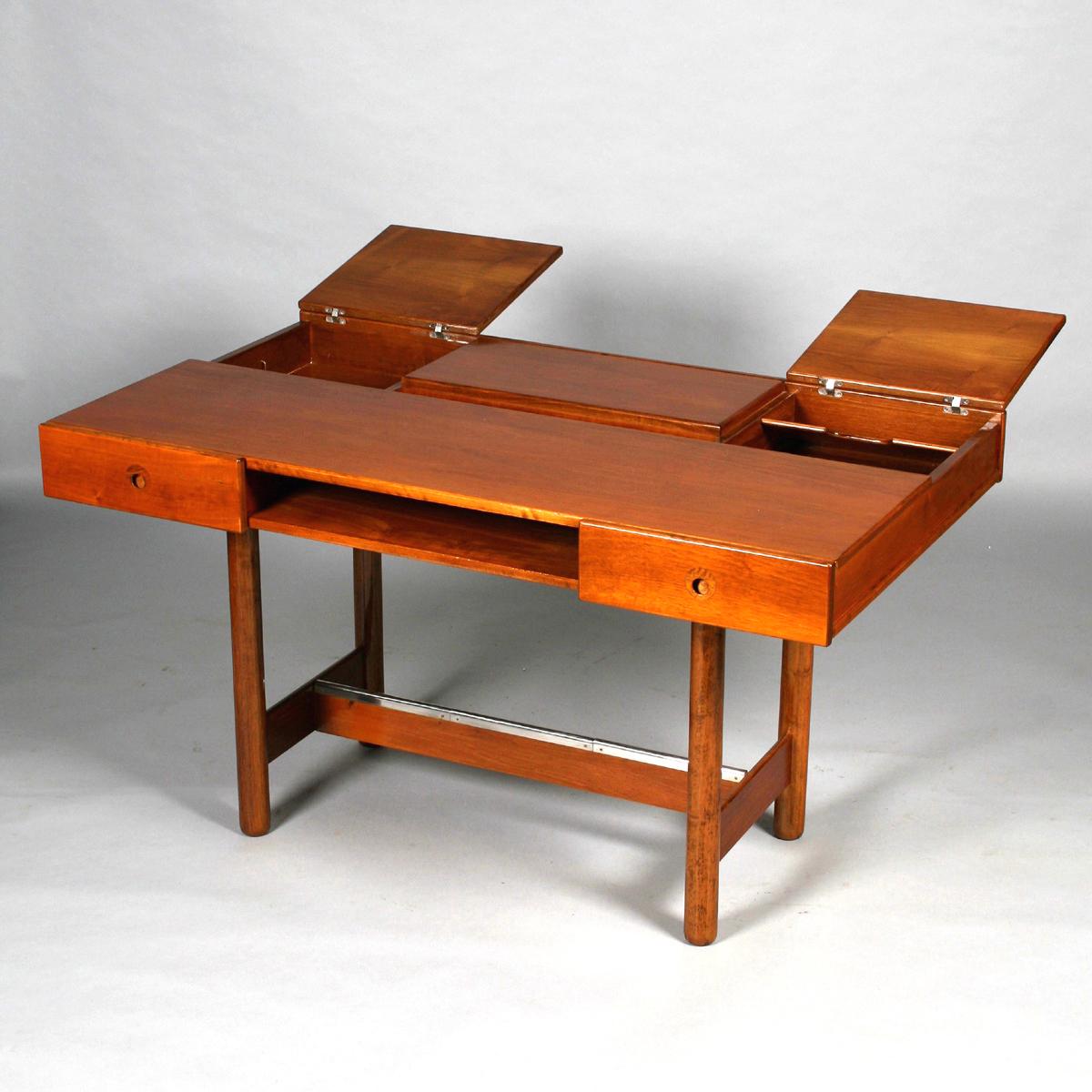 Fruitwood desk with chrome footrests by Saporiti. There are two drawers and a top that opens to gain access to storage compartments within.