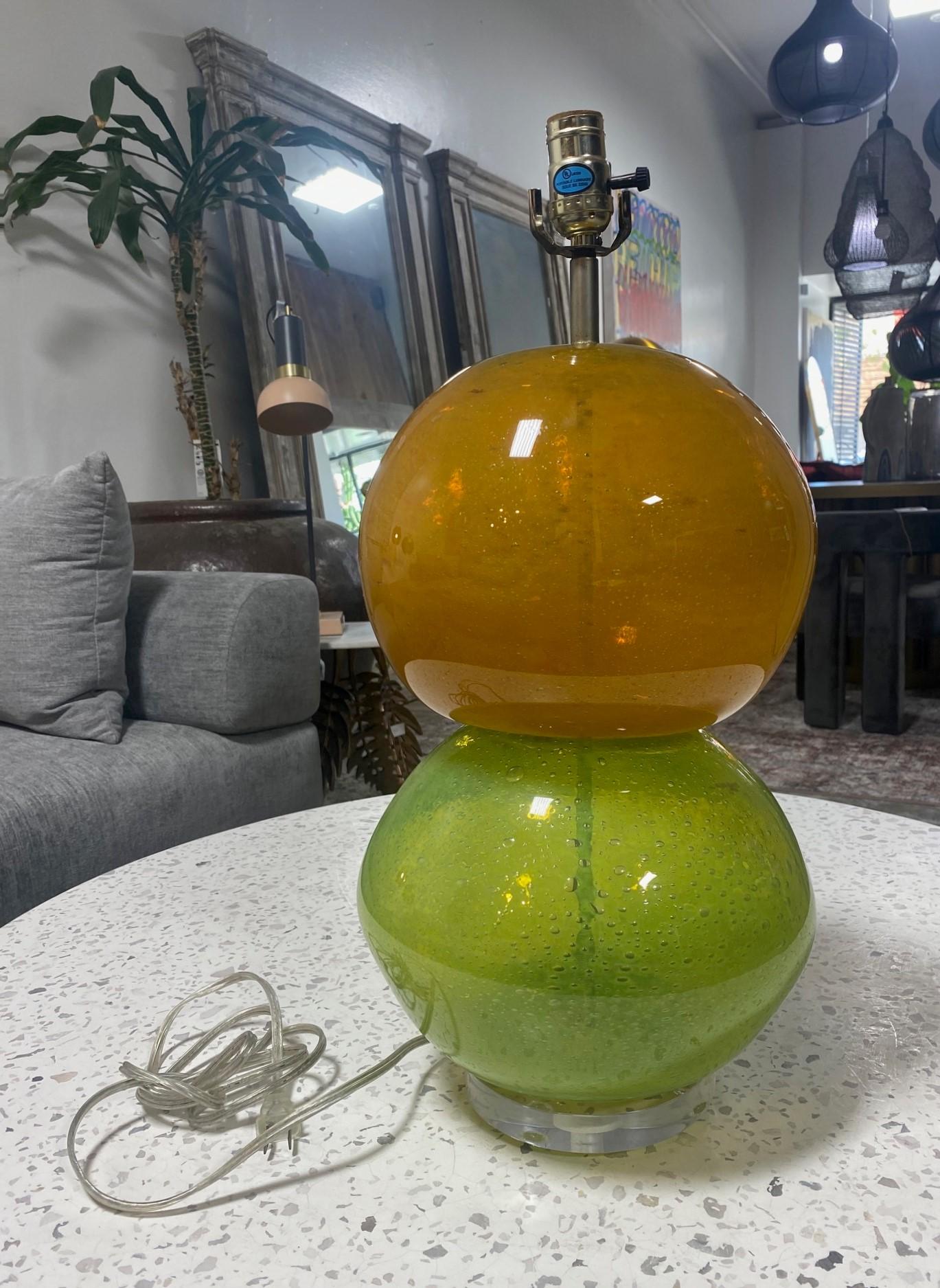 A wonderful, funky, rather playful two-colored double stacked blown glass table lamp likely from the 1960s-1980s. Great shape and design. We have not seen another quite like it. The lamp is mounted on a lucite base. 

From a Los Angeles