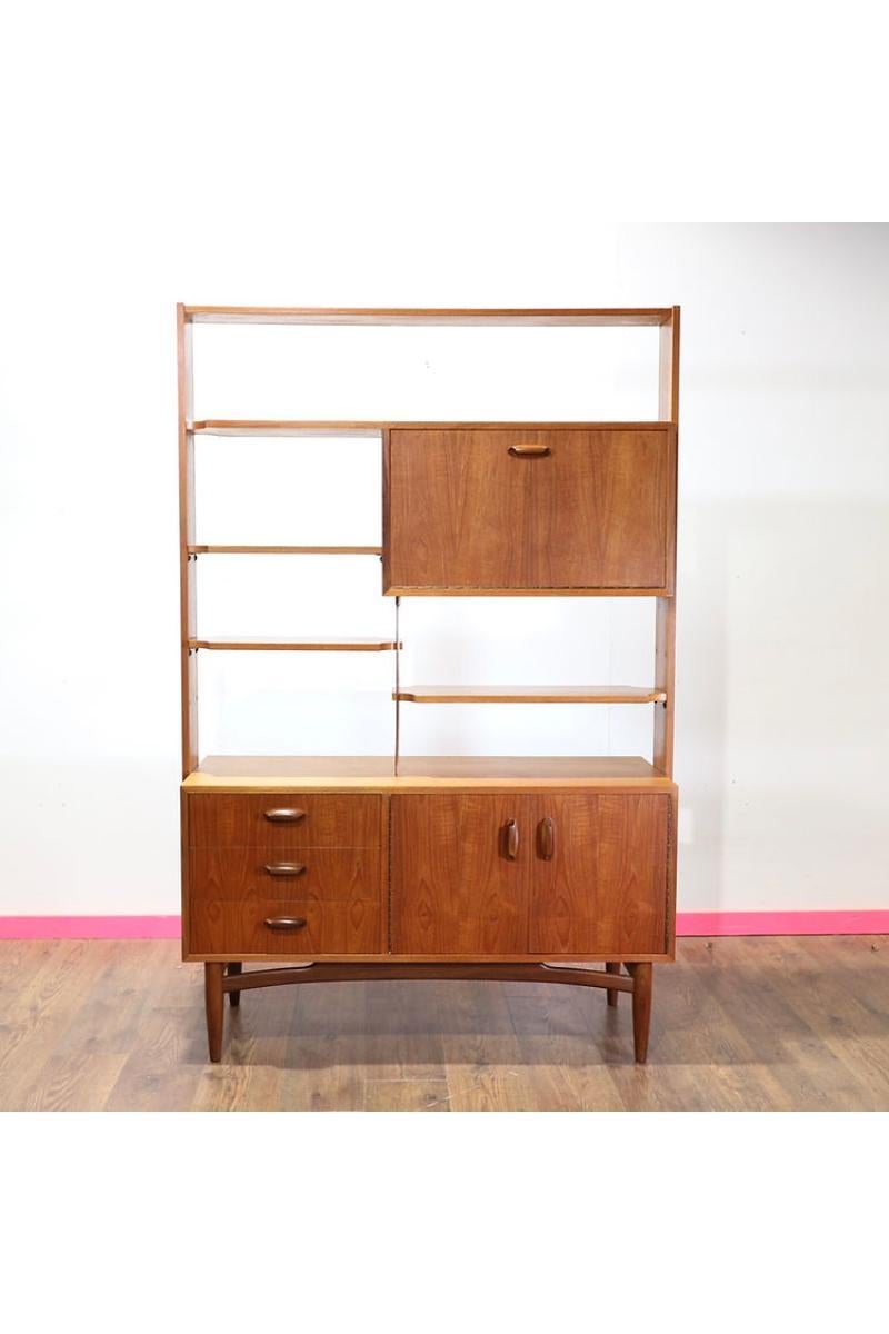 Introducing a stunning Mid Century room divider and wall unit by G Plan, exclusively available at Mid Century Traders. This gorgeous-looking classic offers plenty of storage and display space, making it both functional and visually appealing.