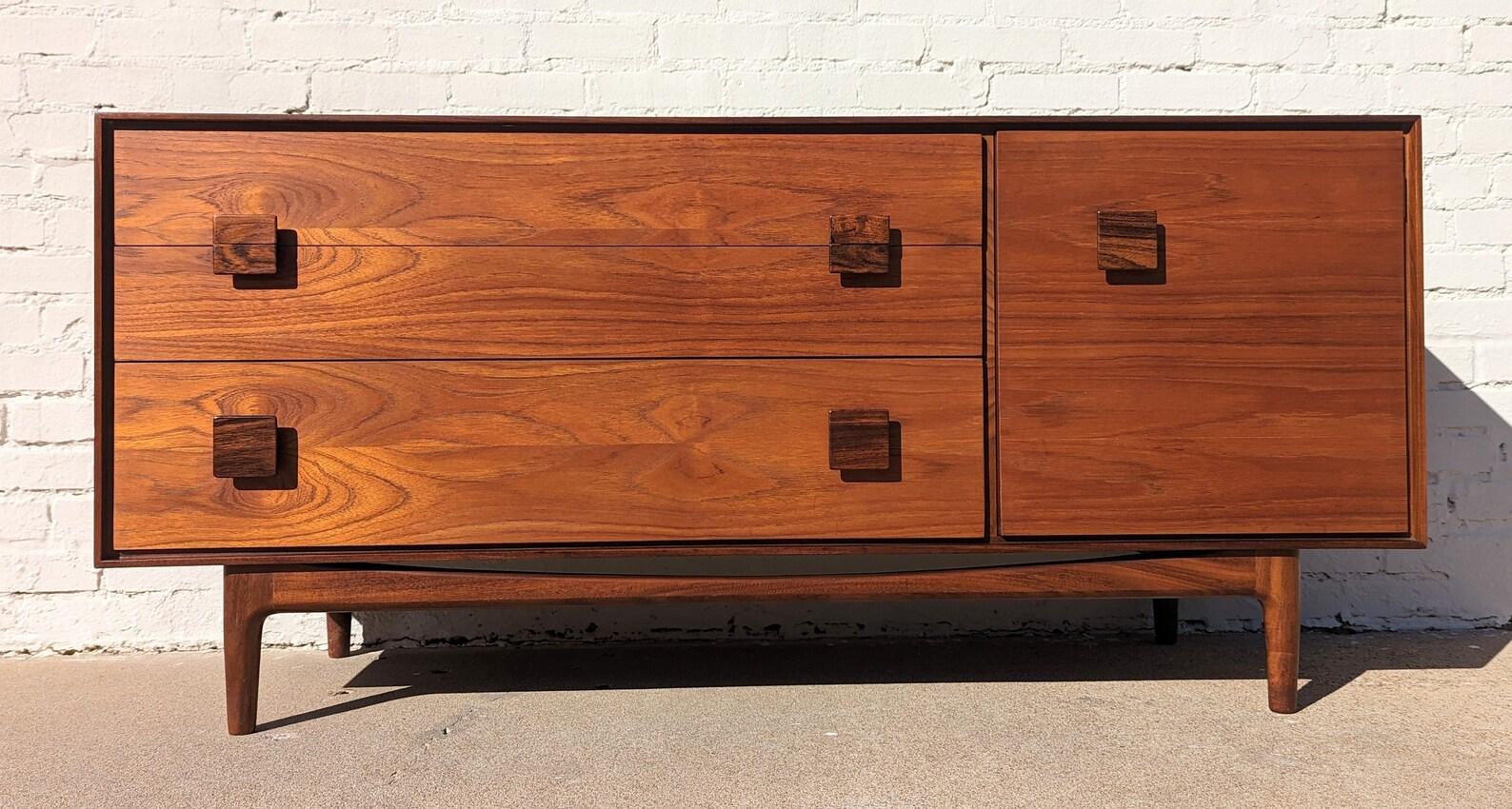 Mid Century Modern G Plan Credenza by Kofod Larsen
 
Above average vintage condition and structurally sound. Has some expected slight finish wear and scratching. Has a couple small dings and discolorations on top. Outdoor listing pictures might