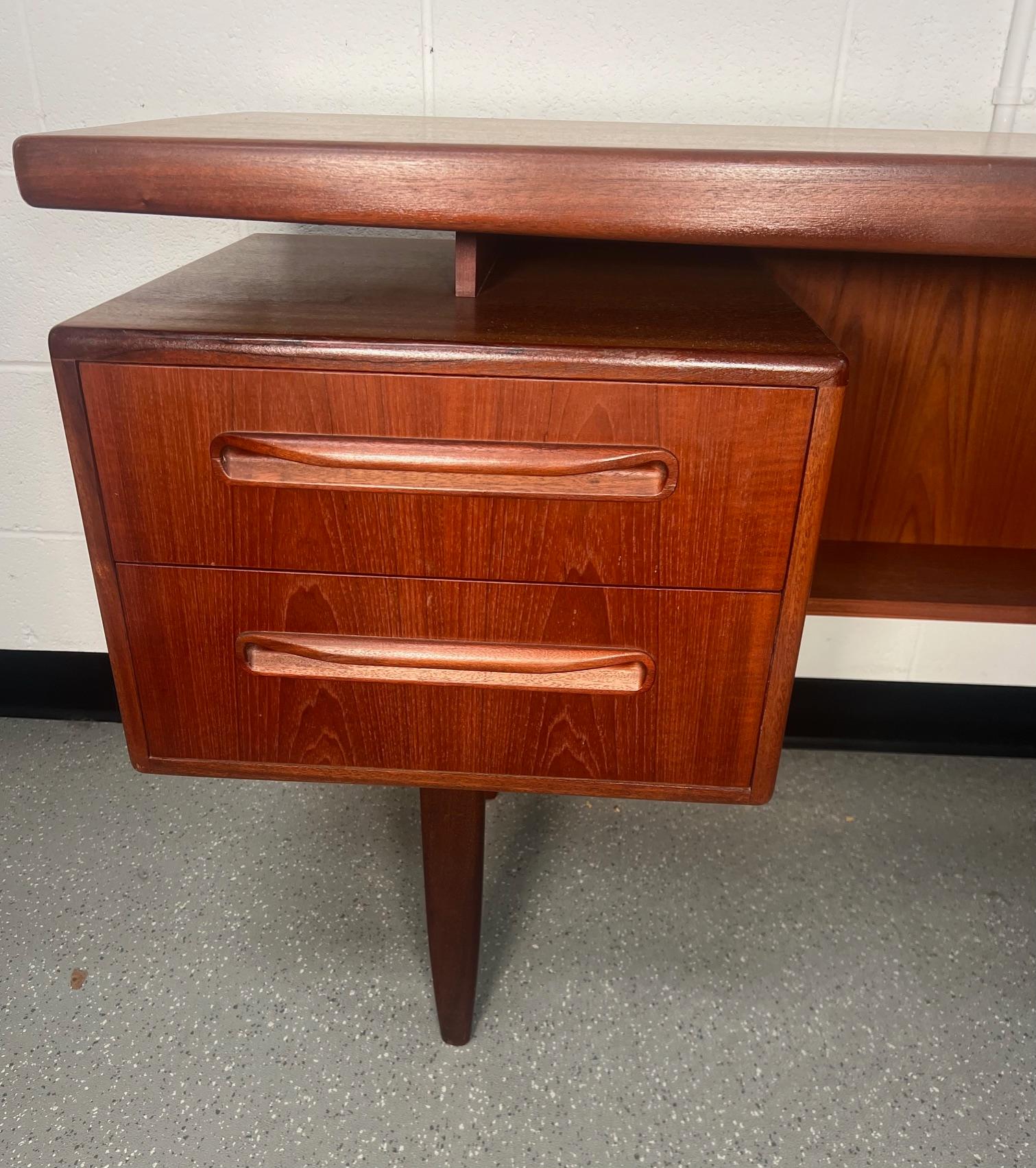 Fantastic mid-century teak vanity or desk.
Designed in the 60s by Victor Bramwell Wilkins for G Plan's Fresco Range. Danish Modern in style. Small removable tray in left top drawer. This is the version that does not have a secret middle drawer.