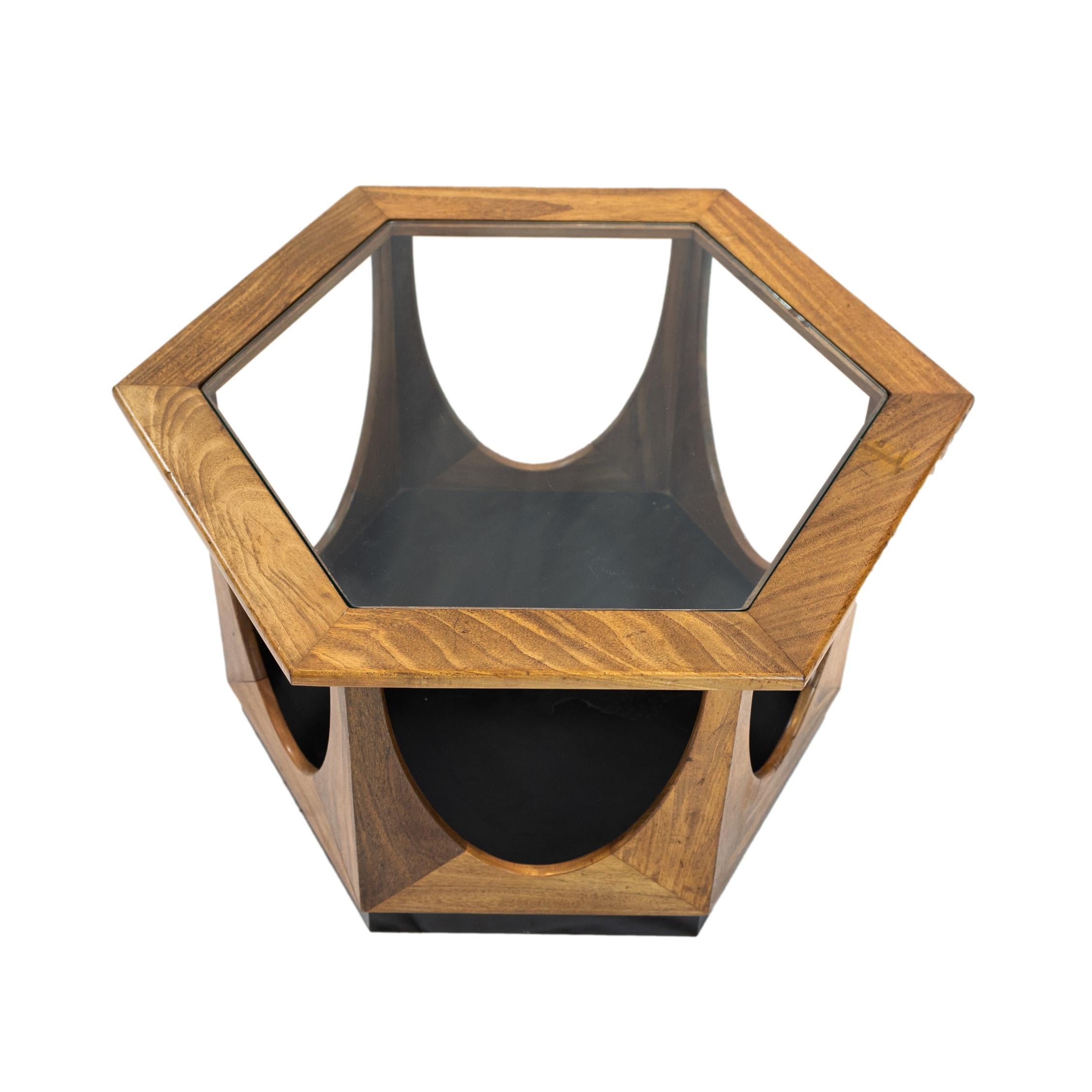 G-Plan Hexagonal Coffee or Side Table, designed by Victor Bramwell (V.B.) Wilkins and produced in the 1960s. Constructed in teak, with an ebonized interior cage section and plinth base, with glass inserted top. 
 When the years of rationing in