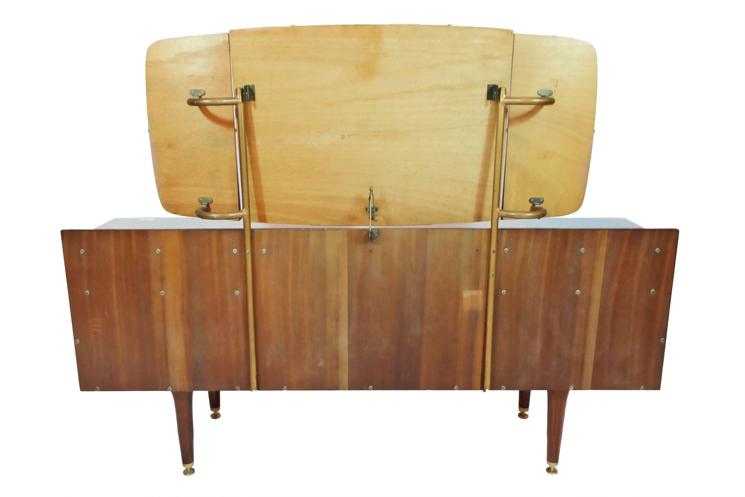 Mid-Century Modern vanity dressing table of teak and rosewood. The three mirrors are fully adjustable. Stamped G-Plan. Designed by Ib Kofod-Larsen for G-Plan.