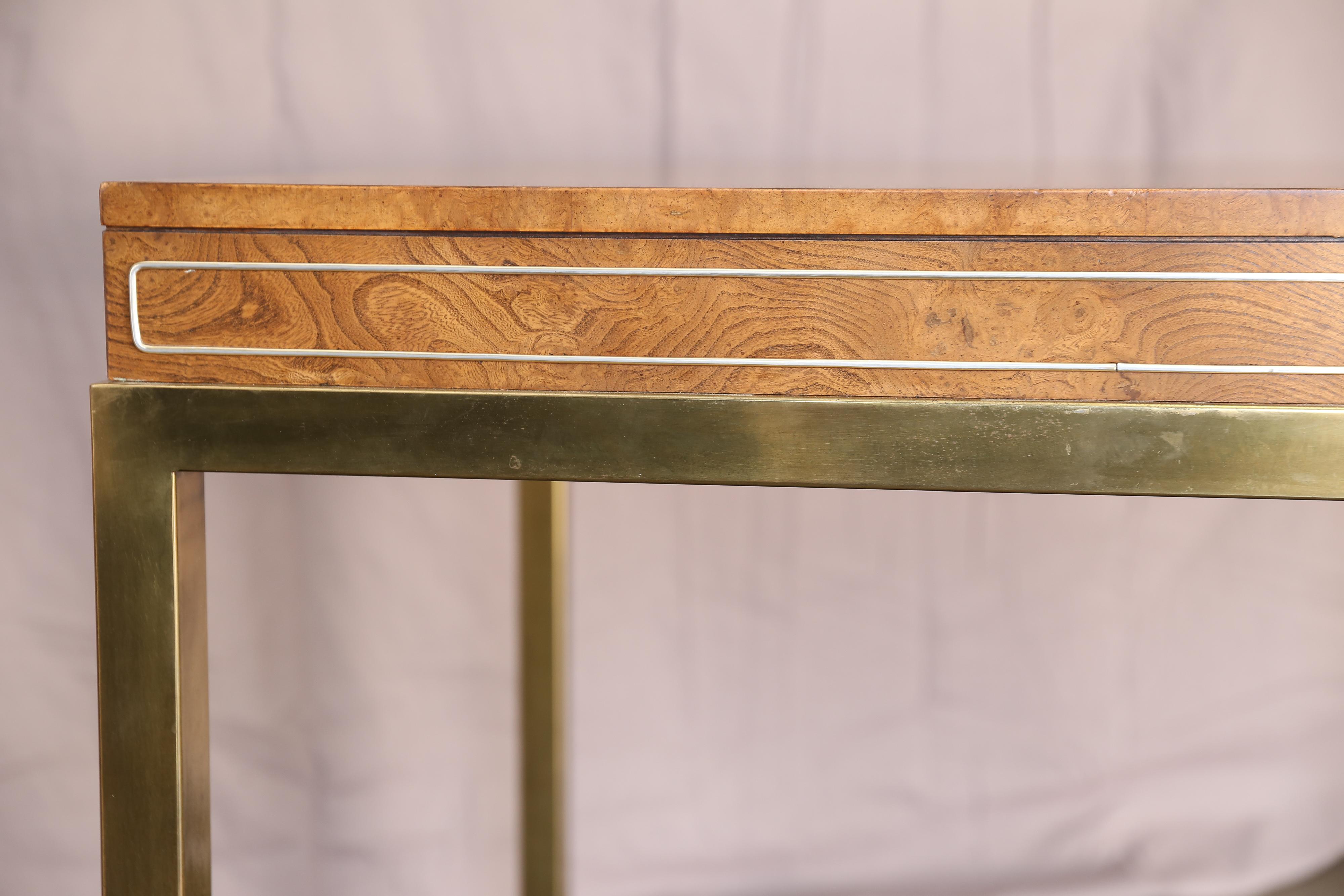 Contemporary brass inlaid walnut square table. Table is in excellent condition.