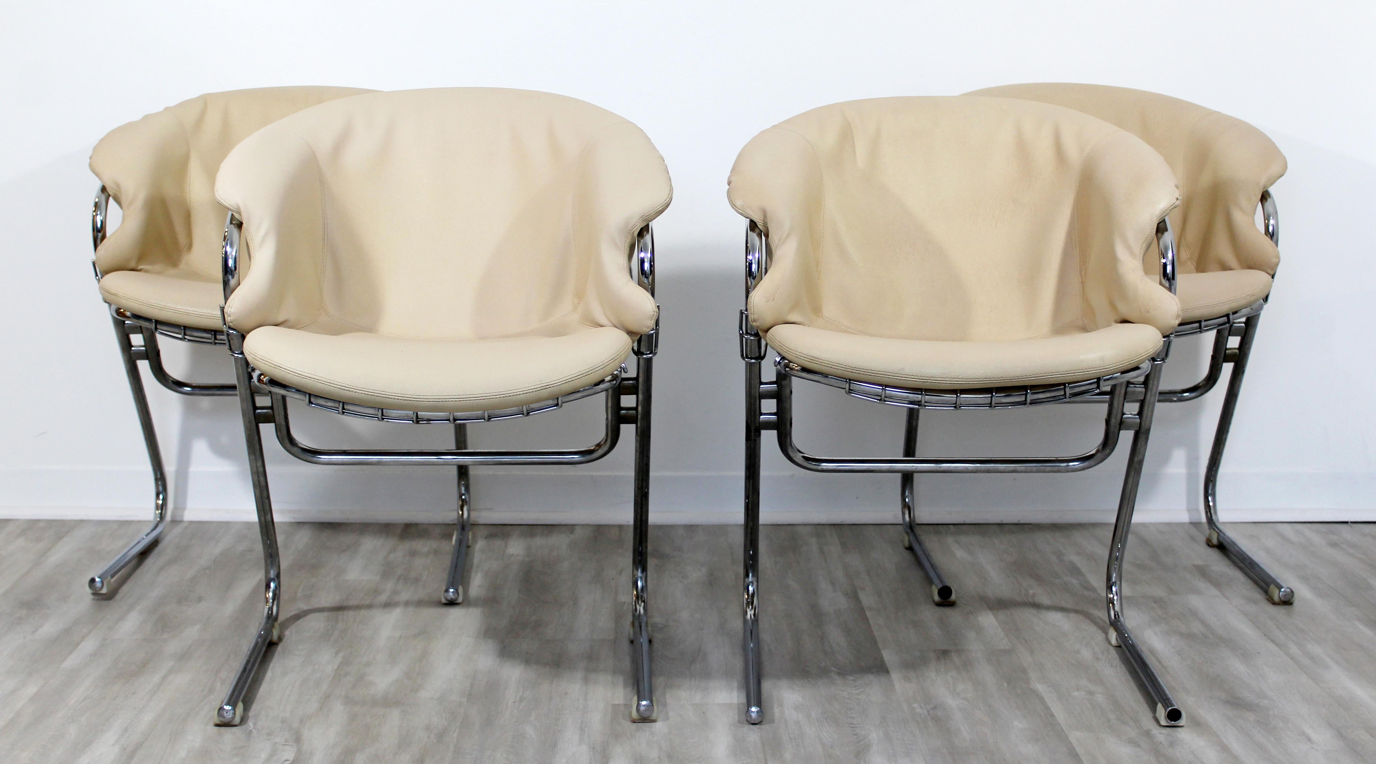 For your consideration is a luxe set of four cantilevered chrome and leather lounge armchairs, by Gastone Rinaldi for Thema, made in Italy, circa 1970s. In very good condition. The dimensions are 23.5