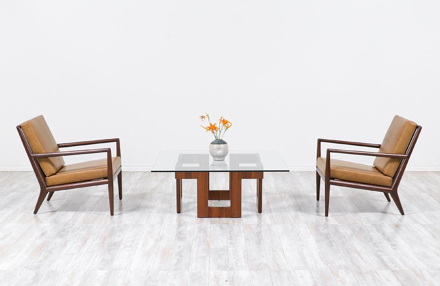 Mid-Century Modern geometric walnut coffee table with glass top.