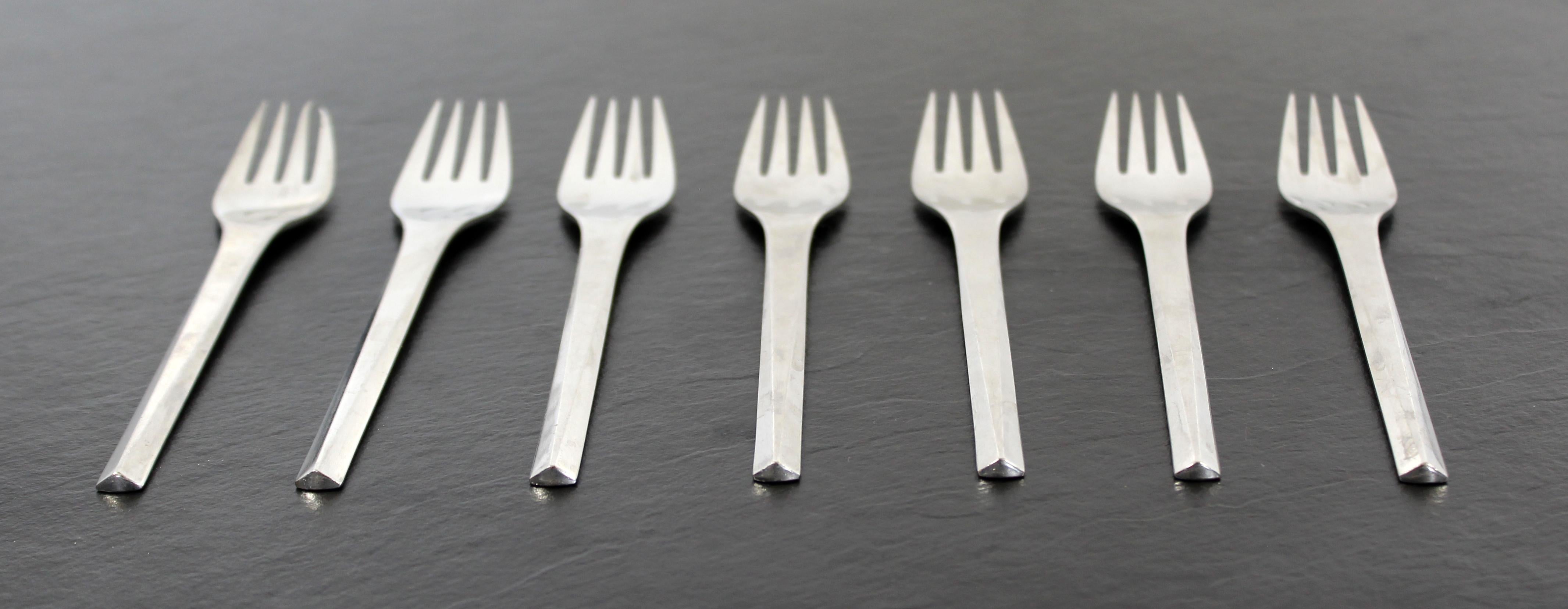 For your consideration is a set of seven, matte stainless steel salad forks, from the Prism cutlery series, by Georg Jensen, circa the 1960s. All pieces stamped 
