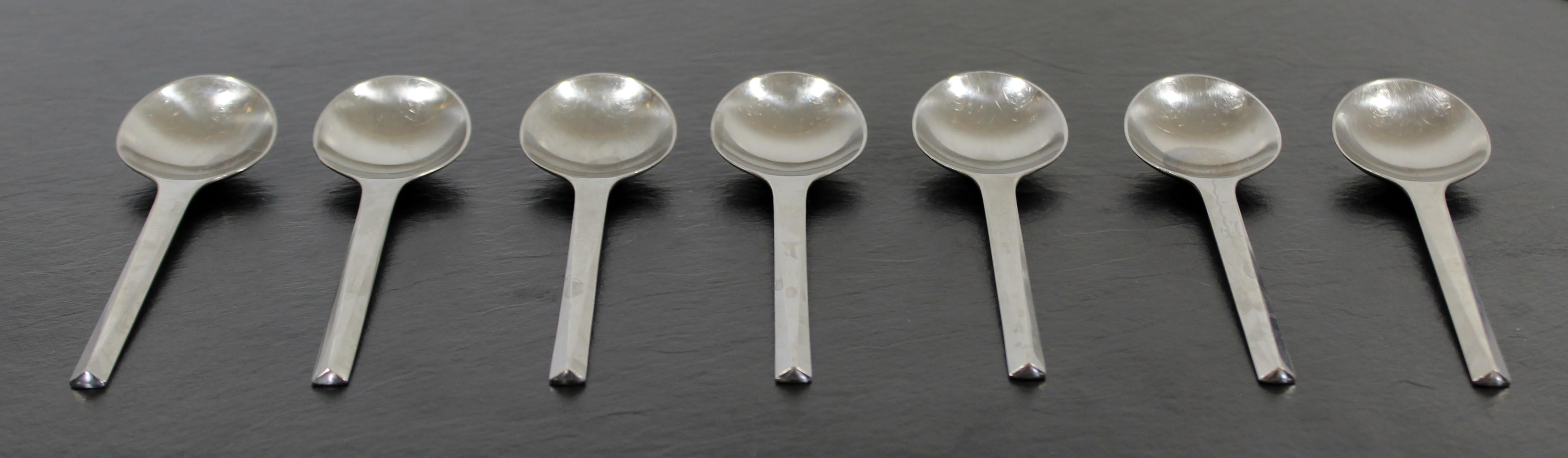 For your consideration is a set of seven, matte stainless steel soup spoons from the Prism cutlery series, by Georg Jensen, circa 1960s. All pieces stamped 