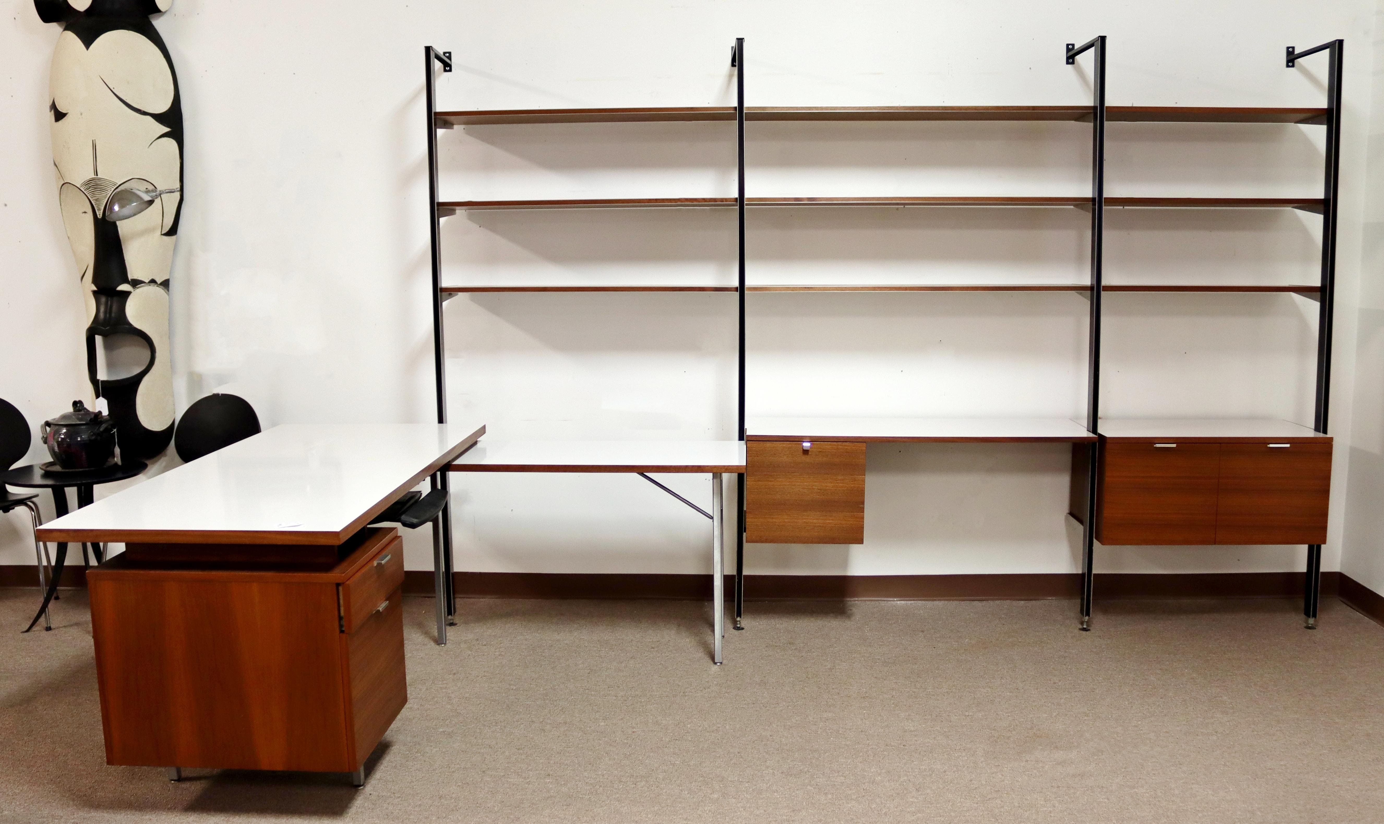 For your consideration is an incredible wall unit, with a laminate desk return, by George Nelson, circa the 1960s. In excellent vintage condition. The dimensions are 146