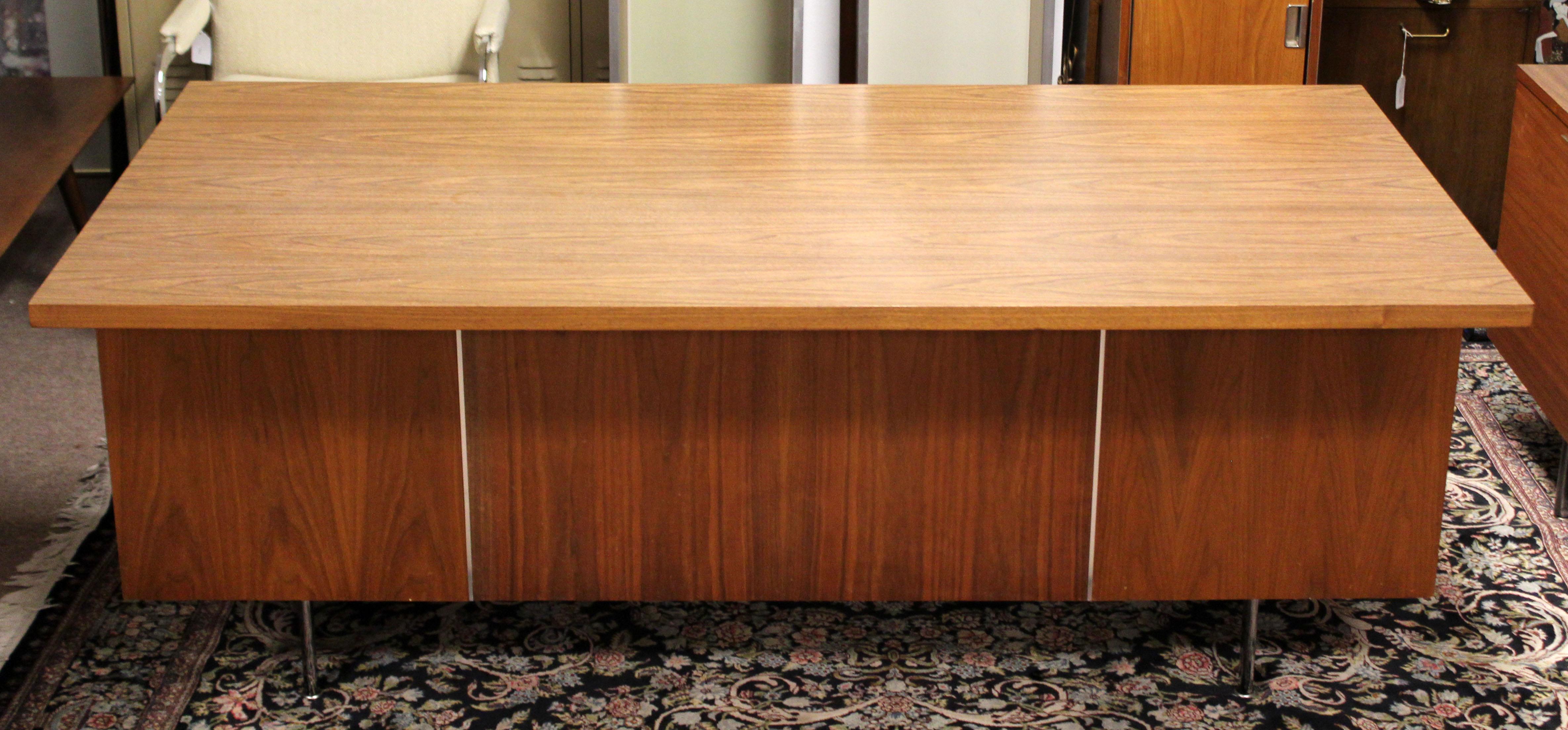 For your consideration is a marvelous, office desk, with five drawers, by George Nelson for Herman Miller, circa the 1950s. Walnut wood with floating top. In very good condition. The dimensions are 71