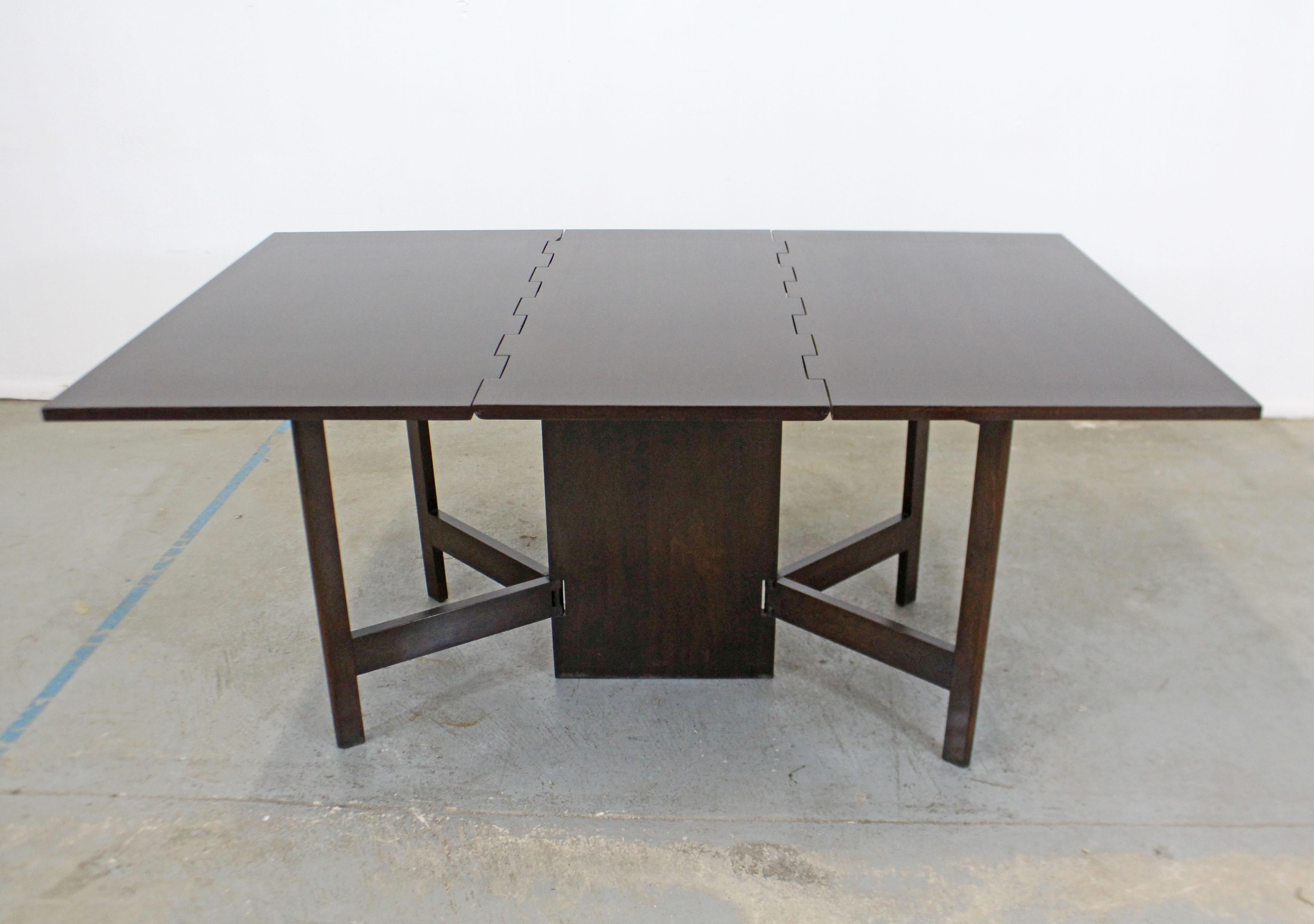 Offered is a gorgeous drop-leaf table designed by George Nelson for Herman Miller. This is a great midcentury table that has the look. Features a dark walnut finish and gate legs. It is in good condition with some age wear (has been refinished at