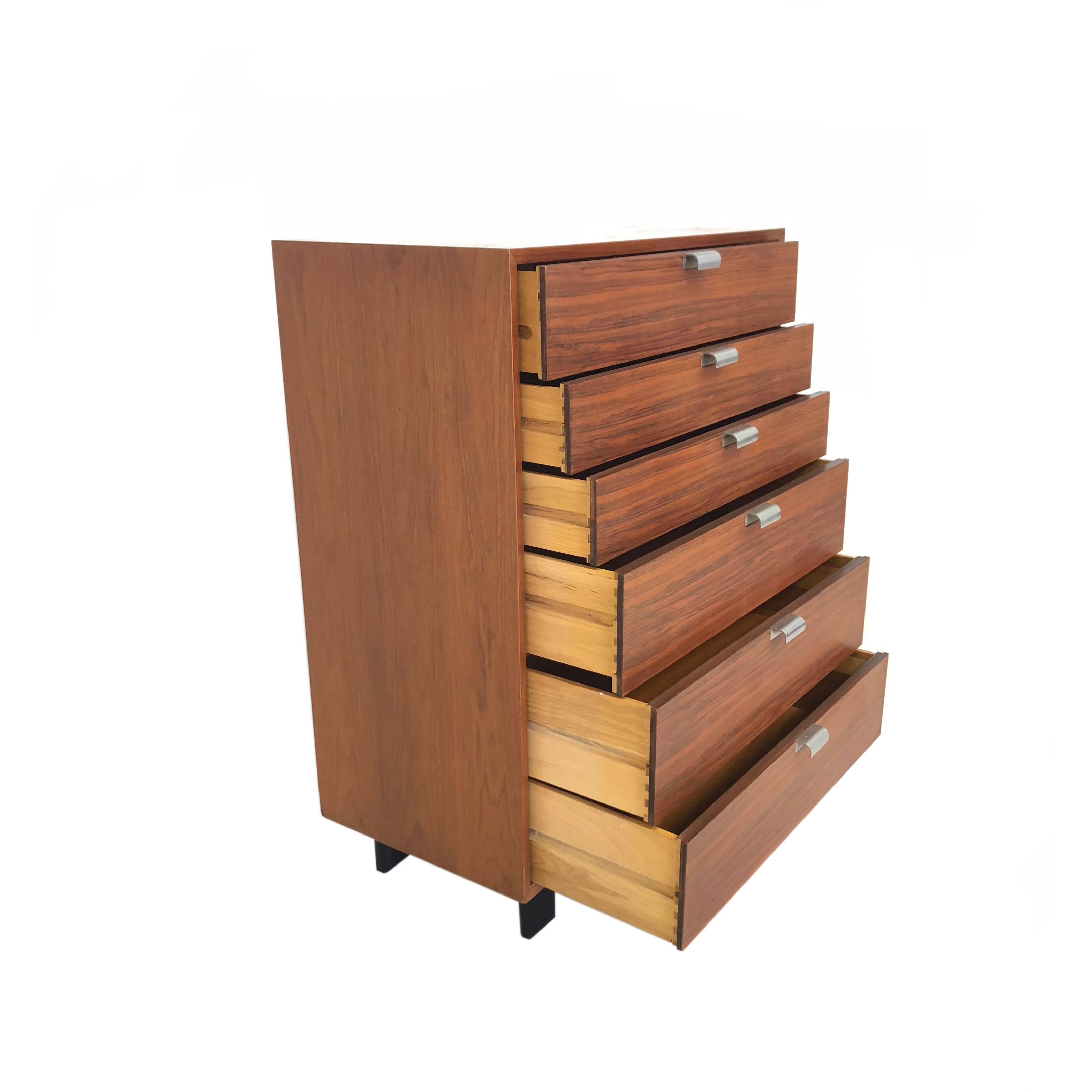 Midcentury George Nelson for Herman Miller tallboy dresser with six drawers, part of the basic storage components that George Nelson designed for Herman Miller in 1952. Topmost drawer partitioned into six sections.

Also available: matching vanity