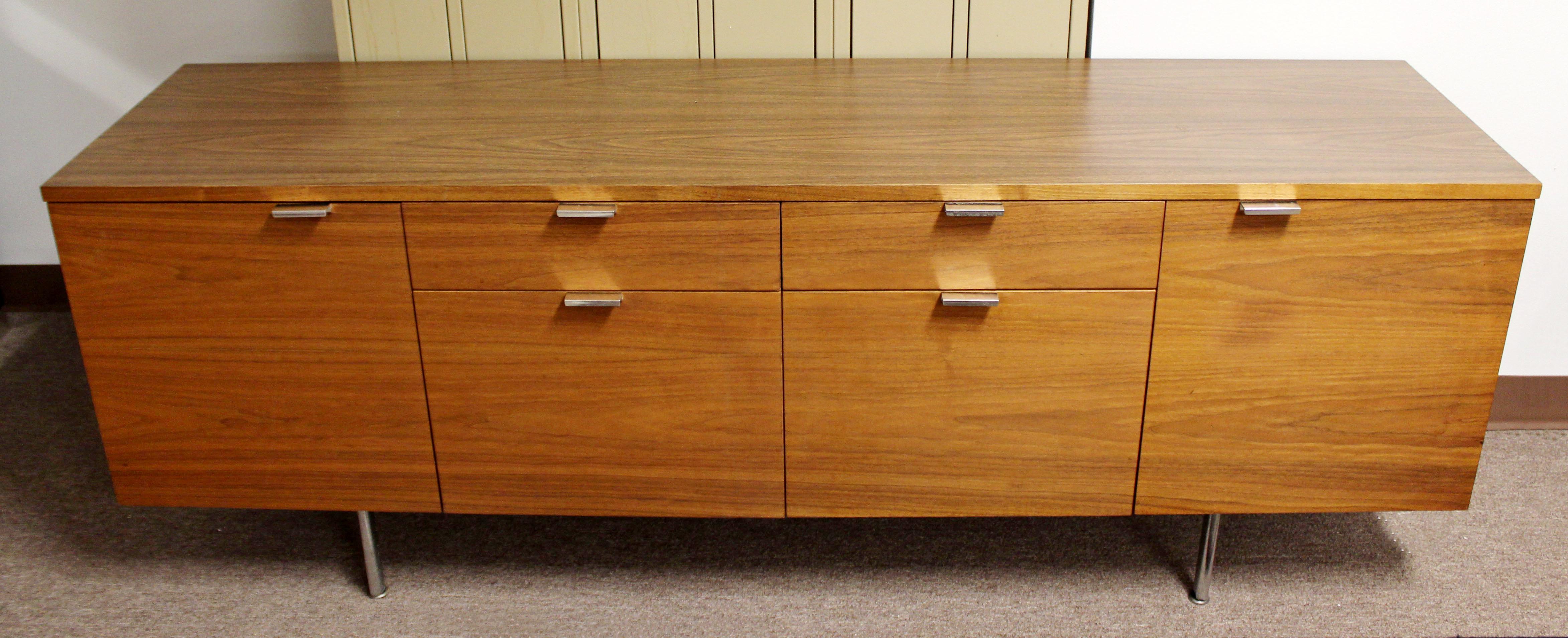 For your consideration is a wonderful, walnut credenza, with four drawers and two shelves, by George Nelson for Herman Miller, circa the 1950s. In excellent condition. The dimensions are 74