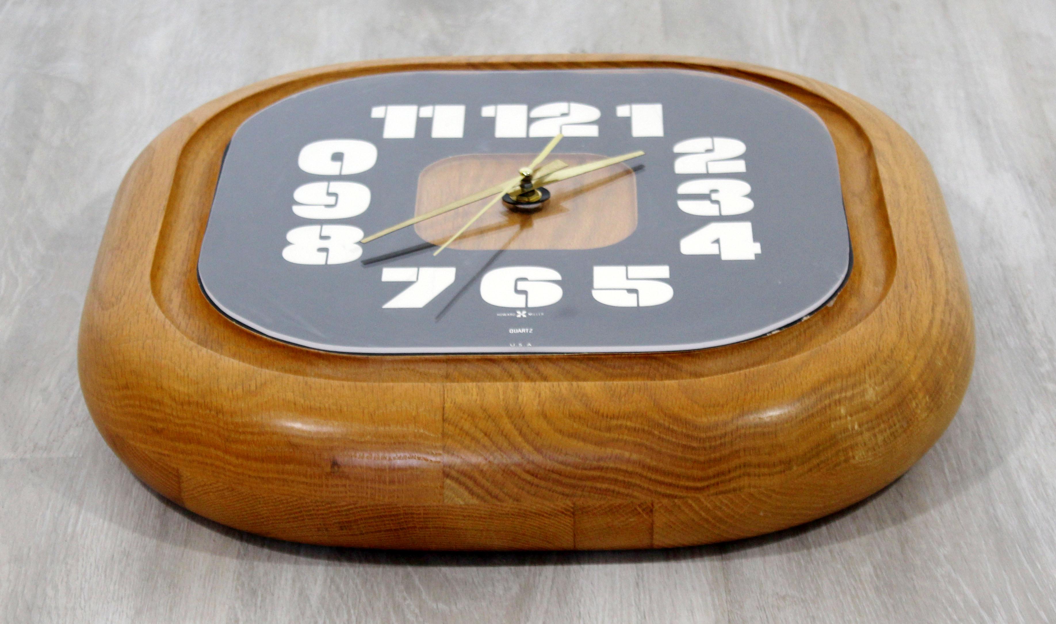 For your consideration is a phenomenal, square wall clock, made of solid wood, by George Nelson for Howard Miller, circa 1960s. In excellent vintage condition. The dimensions are 14.5