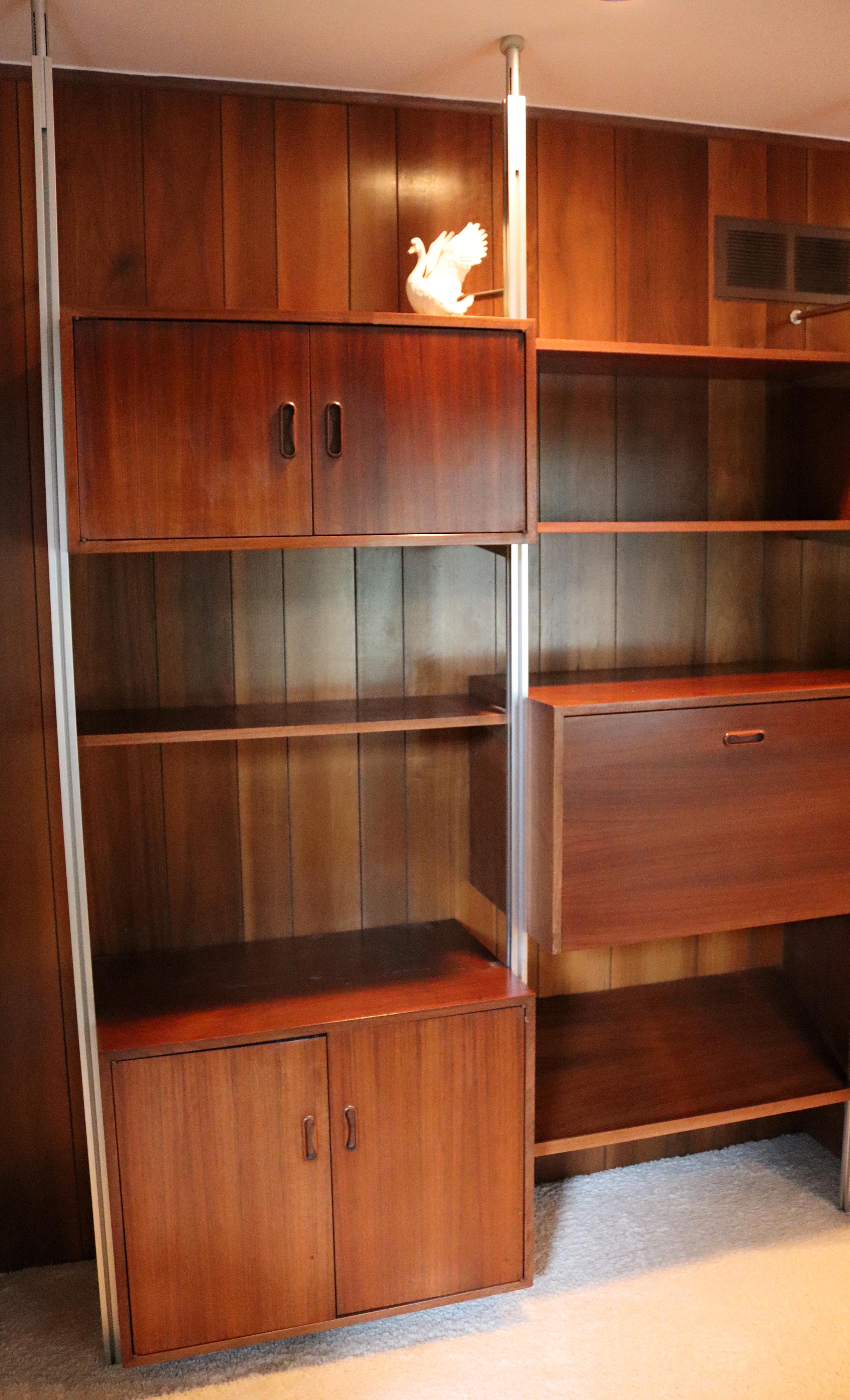 For your consideration is a wonderful Omni wall unit, with three bays and tons of storage compartments, by George Nelson, circa the 1960s. In excellent vintage condition. Dimensions: 98