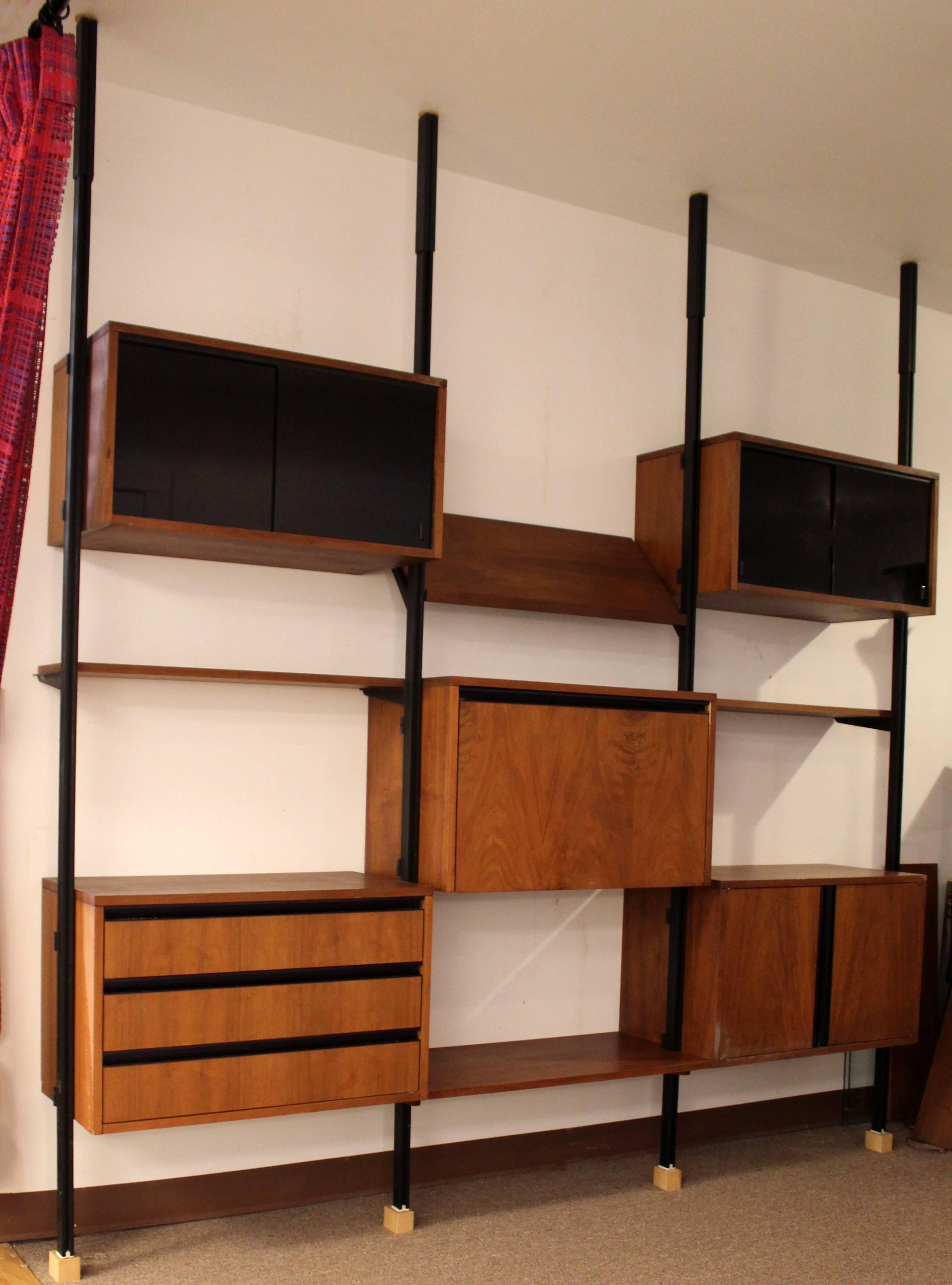 For your consideration is a wonderful, three bay, storage shelving wall unit by George Nelson, circa 1950s. In excellent condition. The dimensions are 91