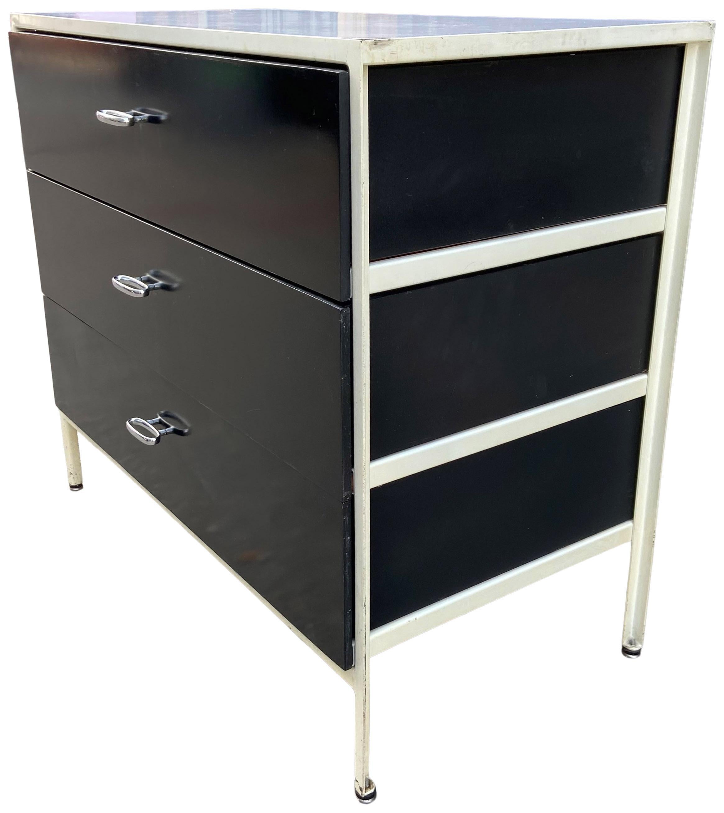 Classic Mid-Century Modern George Nelson steel frame cabinet for Herman Miller. Features three drawers with a black front and painted sides. In original condition showing honest wear from use. Front panels have been repolished.
 
